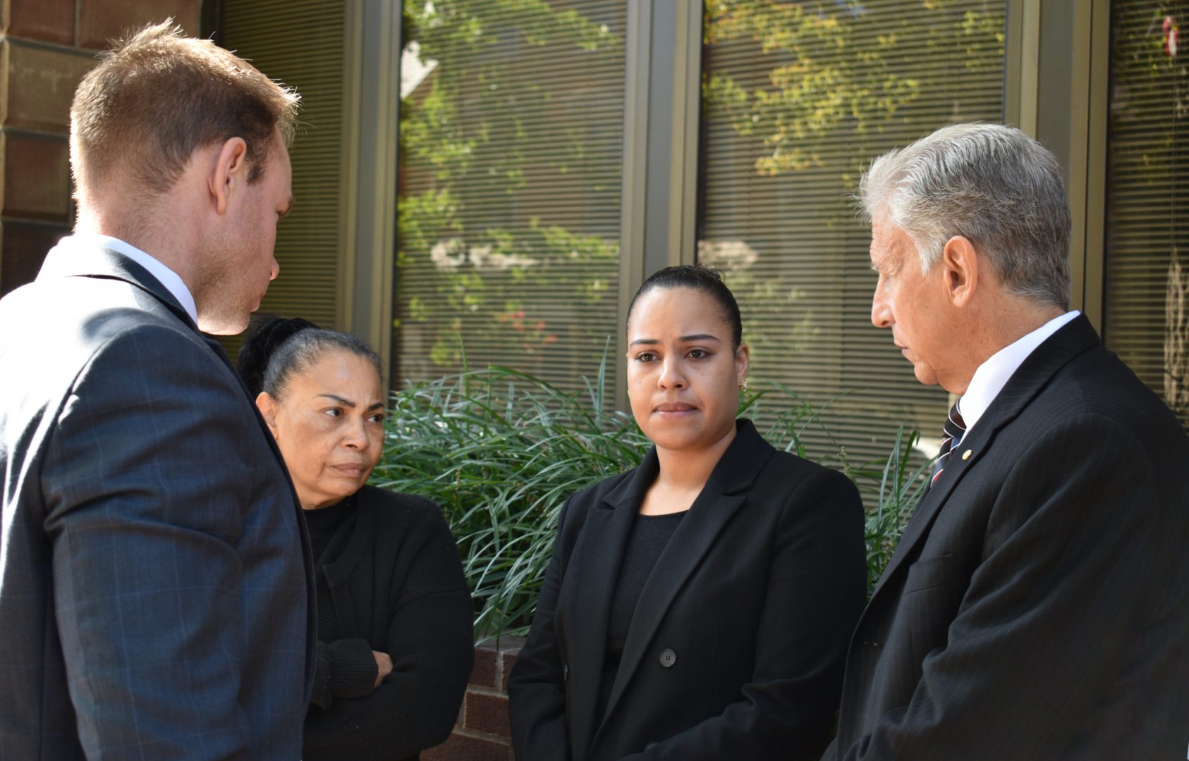 Rulennis Munoz (center right) outside Lancaster Courthouse Oct. 14, after learning that the police officer who fatally shot her brother had been cleared of criminal wrongdoing by the Lancaster County District Attorney. Her mother, Miguelina Peña, and her attorney Michael Perna (far right) stood by.