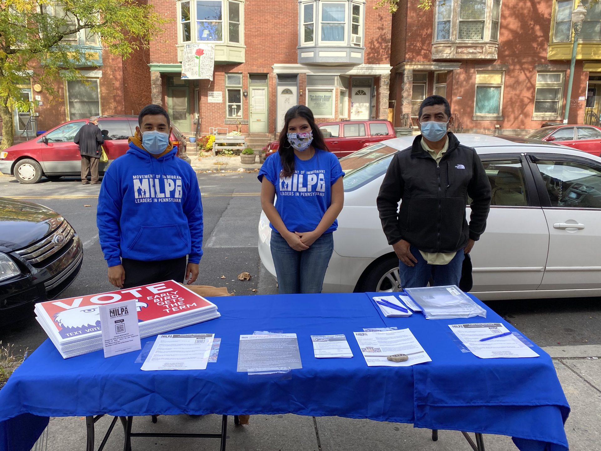 Members of the organization Movement of Immigrant Leaders in Pennsylvania register voters outside a Catholic church in Harrisburg. Alanna Elder/WITF