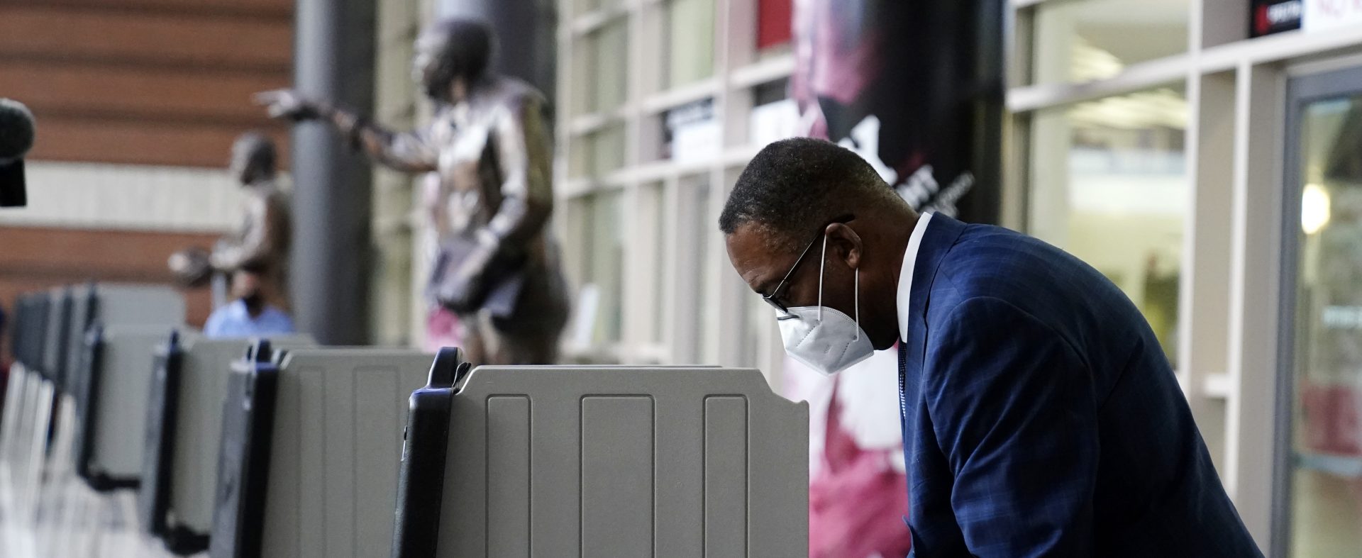 Philadelphia City Council President Darrell L. Clarke fills out his ballot at the opening of a satellite election office at Temple University's Liacouras Center, Tuesday, Sept. 29, 2020, in Philadelphia. P