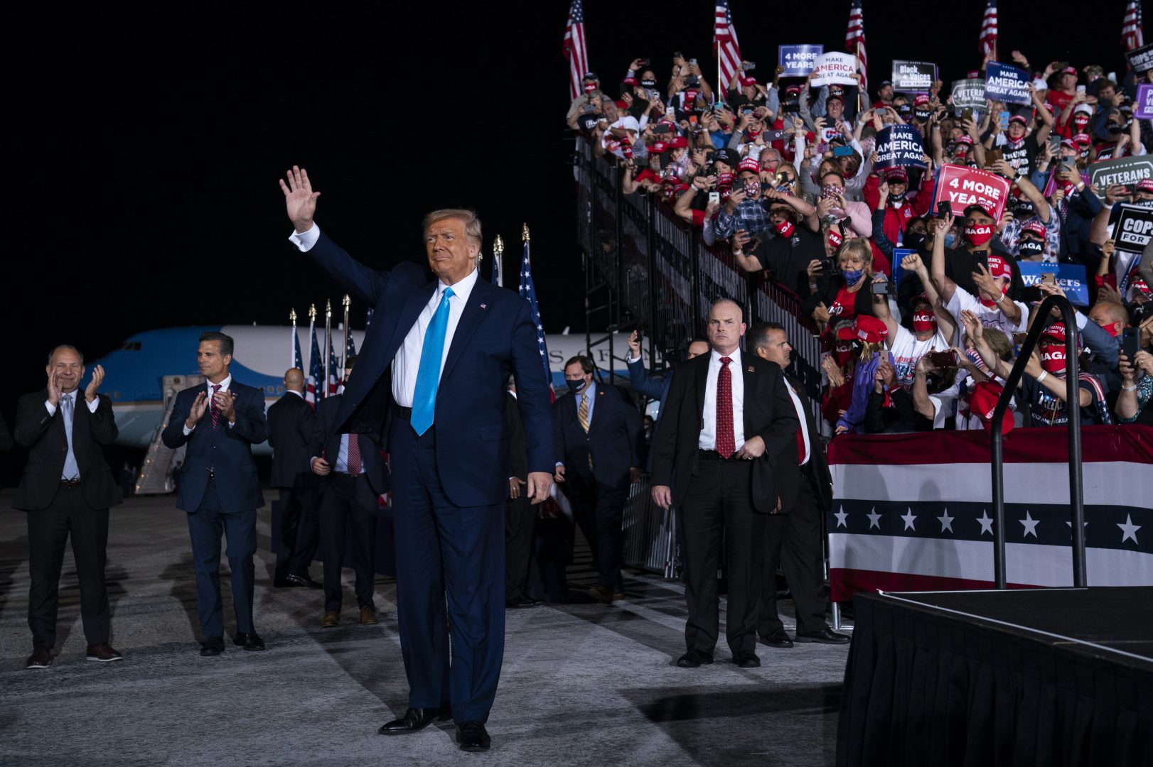 President Donald Trump arrives for a campaign rally at Harrisburg International Airport, Saturday, Sept. 26, 2020, in Middletown. U.S. Rep. Lloyd Smucker, R-Lancaster/York, is at far left.