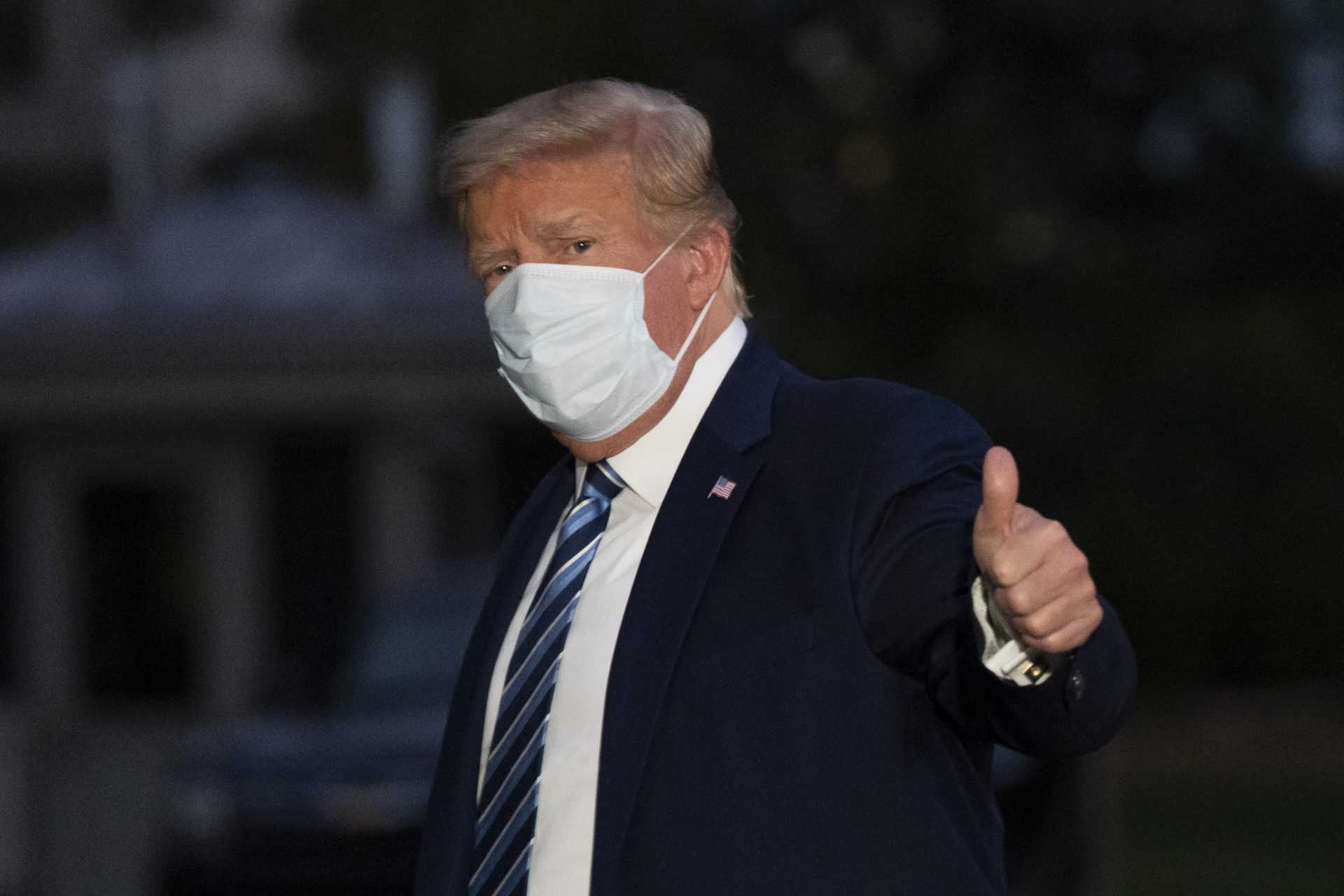 President Donald Trump gives thumbs up as he returns to the White House Monday, Oct. 5, 2020, in Washington, after leaving Walter Reed National Military Medical Center, in Bethesda, Md. Trump announced he tested positive for COVID-19 on Oct. 2.
