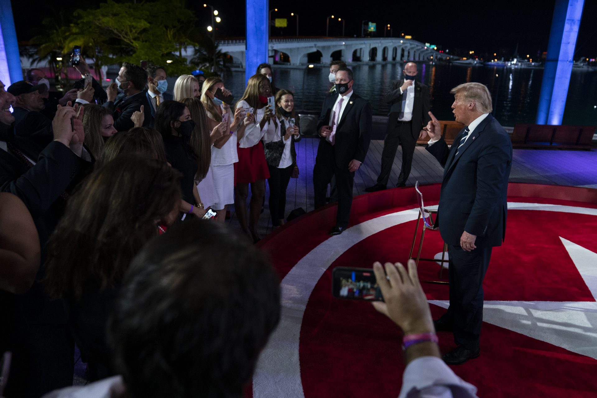 President Donald Trump talks with voters after an NBC News Town Hall, at Perez Art Museum Miami, Thursday, Oct. 15, 2020, in Miami.