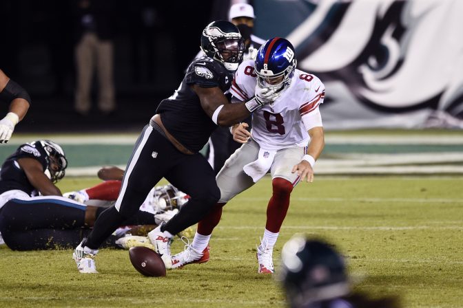 New York Giants' Daniel Jones (8) fumbles after being hit by Philadelphia Eagles' Brandon Graham (55) during the second half of an NFL football game, Thursday, Oct. 22, 2020, in Philadelphia