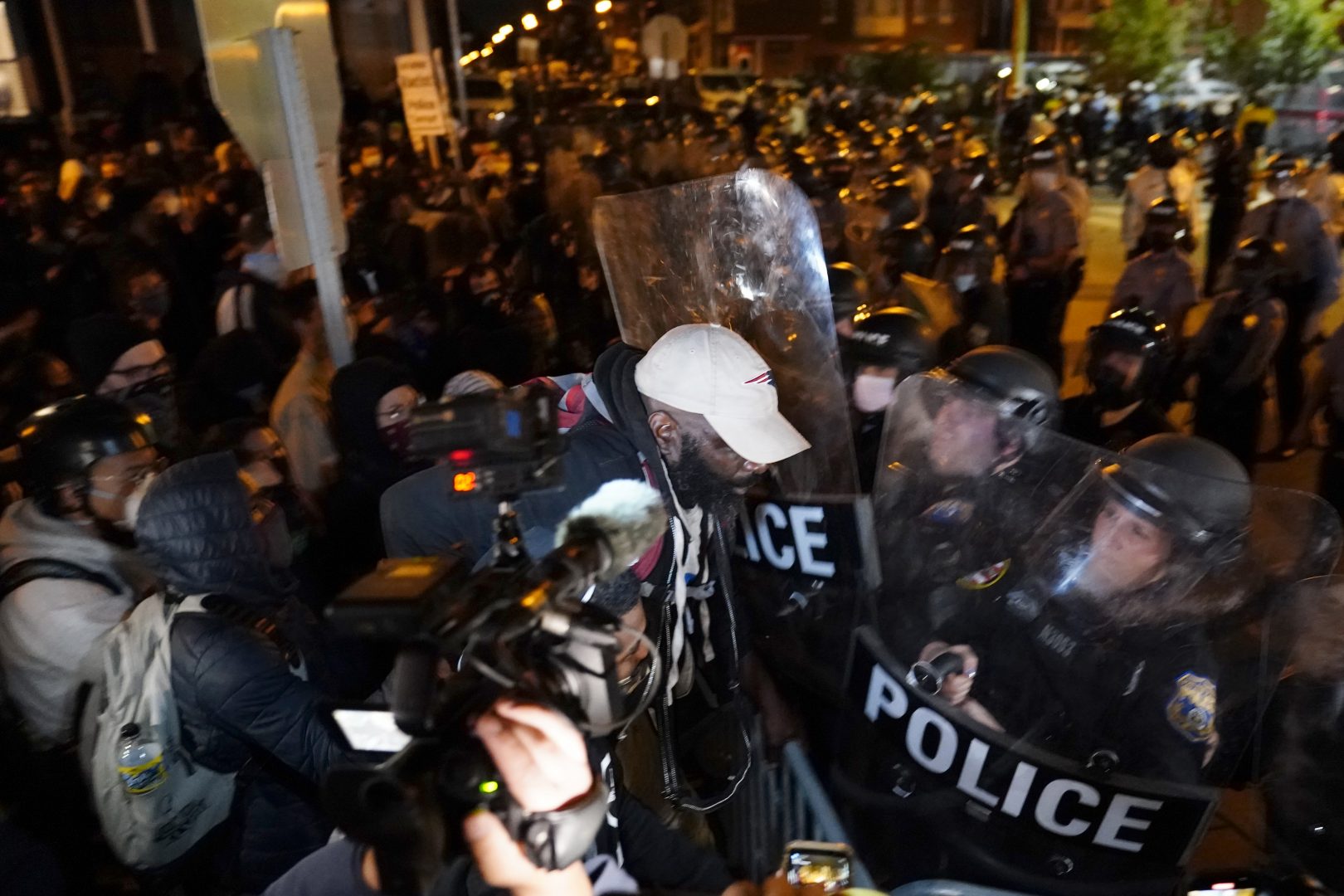 A protester confronts police during a march Tuesday Oct. 27, 2020 in Philadelphia. 