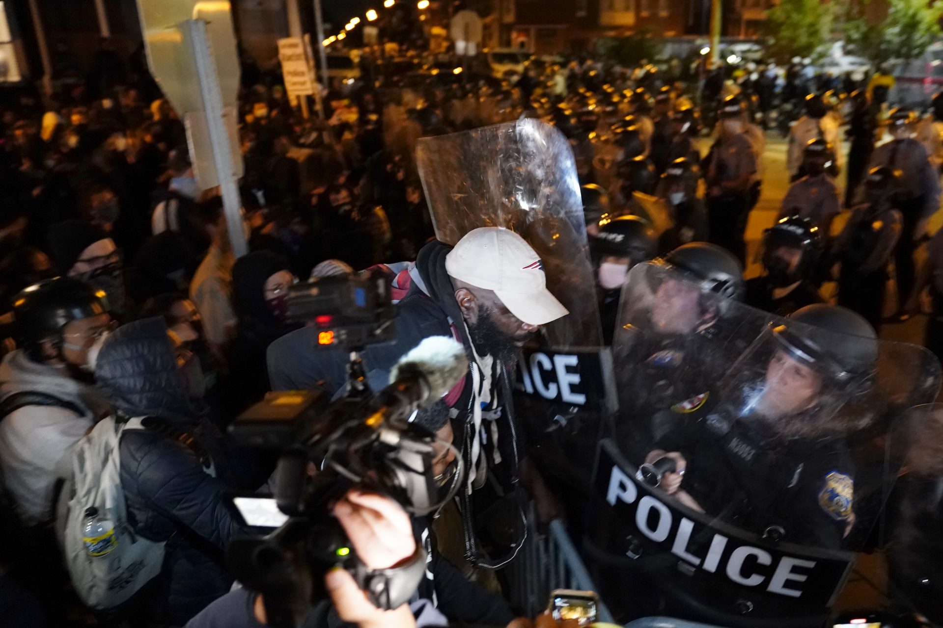A protester confronts police during a march Tuesday Oct. 27, 2020 in Philadelphia.