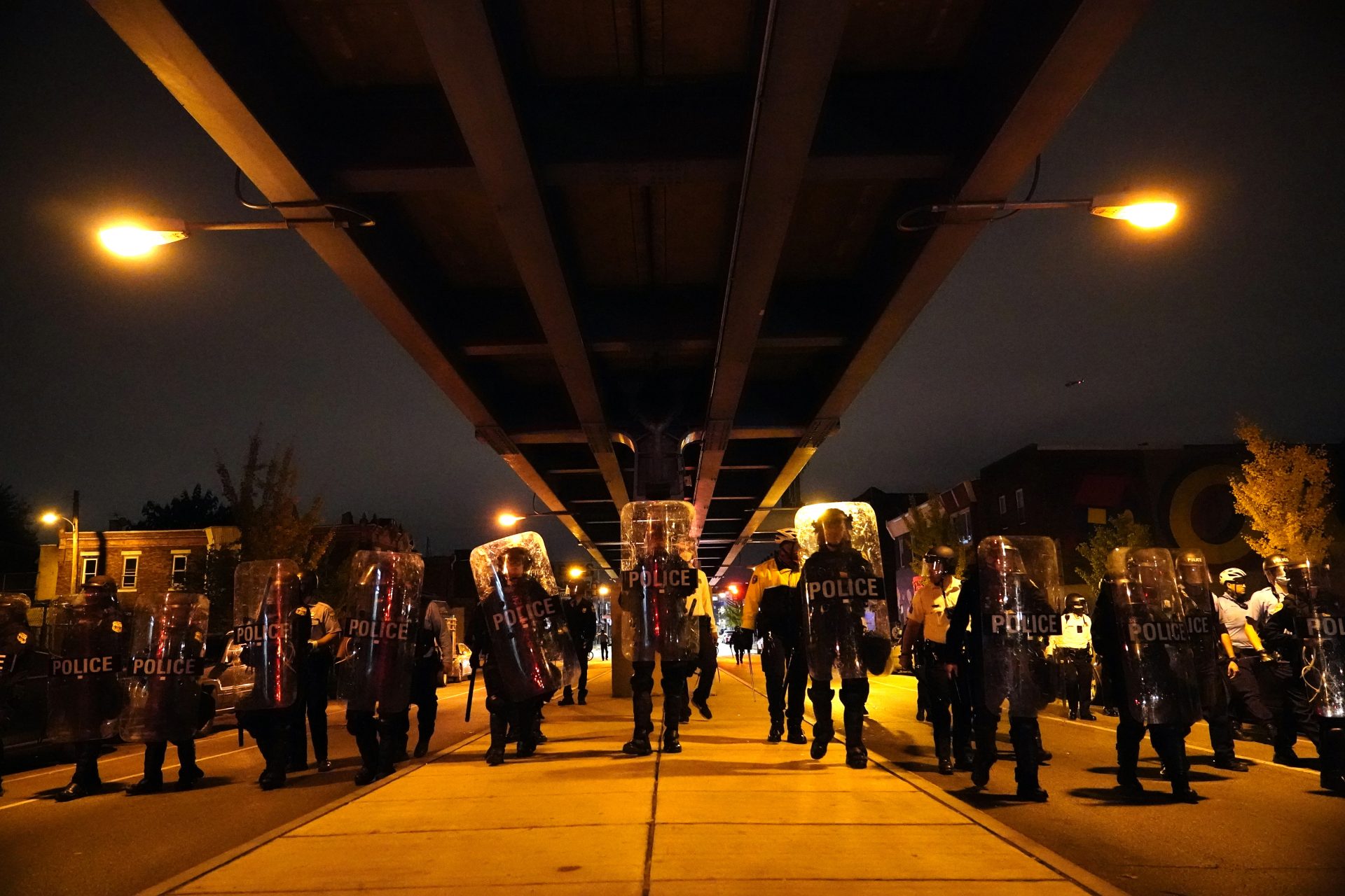 Philadelphia police officers form a line during a demonstration in Philadelphia, late Tuesday, Oct. 27, 2020. Hundreds of demonstrators marched in West Philadelphia over the death of Walter Wallace Jr., a Black man who was killed by police in Philadelphia on Monday. Police shot and killed the 27-year-old on a Philadelphia street after yelling at him to drop his knife.