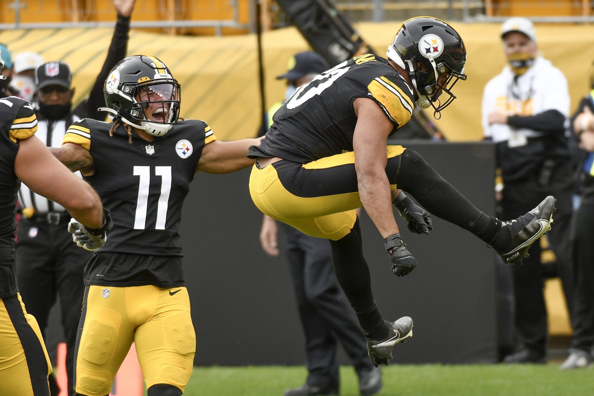 Pittsburgh Steelers running back James Conner (30) leaps after scoring a touchdown against the Cleveland Browns during the first half of an NFL football game, Sunday, Oct. 18, 2020, in Pittsburgh. Steelers wide receiver Chase Claypool (11) also reacts.