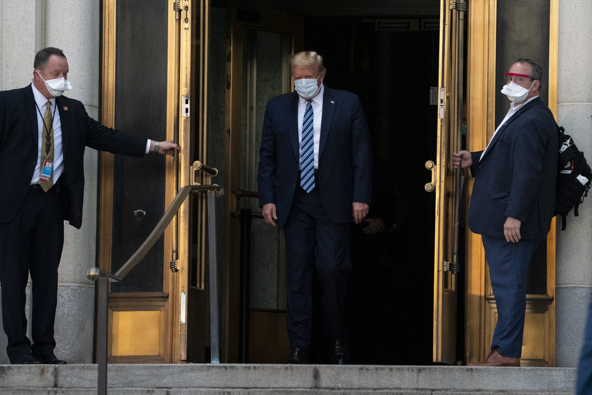 President Donald Trump walks out of Walter Reed National Military Medical Center after receiving treatment as a covid-19 patient, Monday, Oct. 5, 2020, in Bethesda, Md.