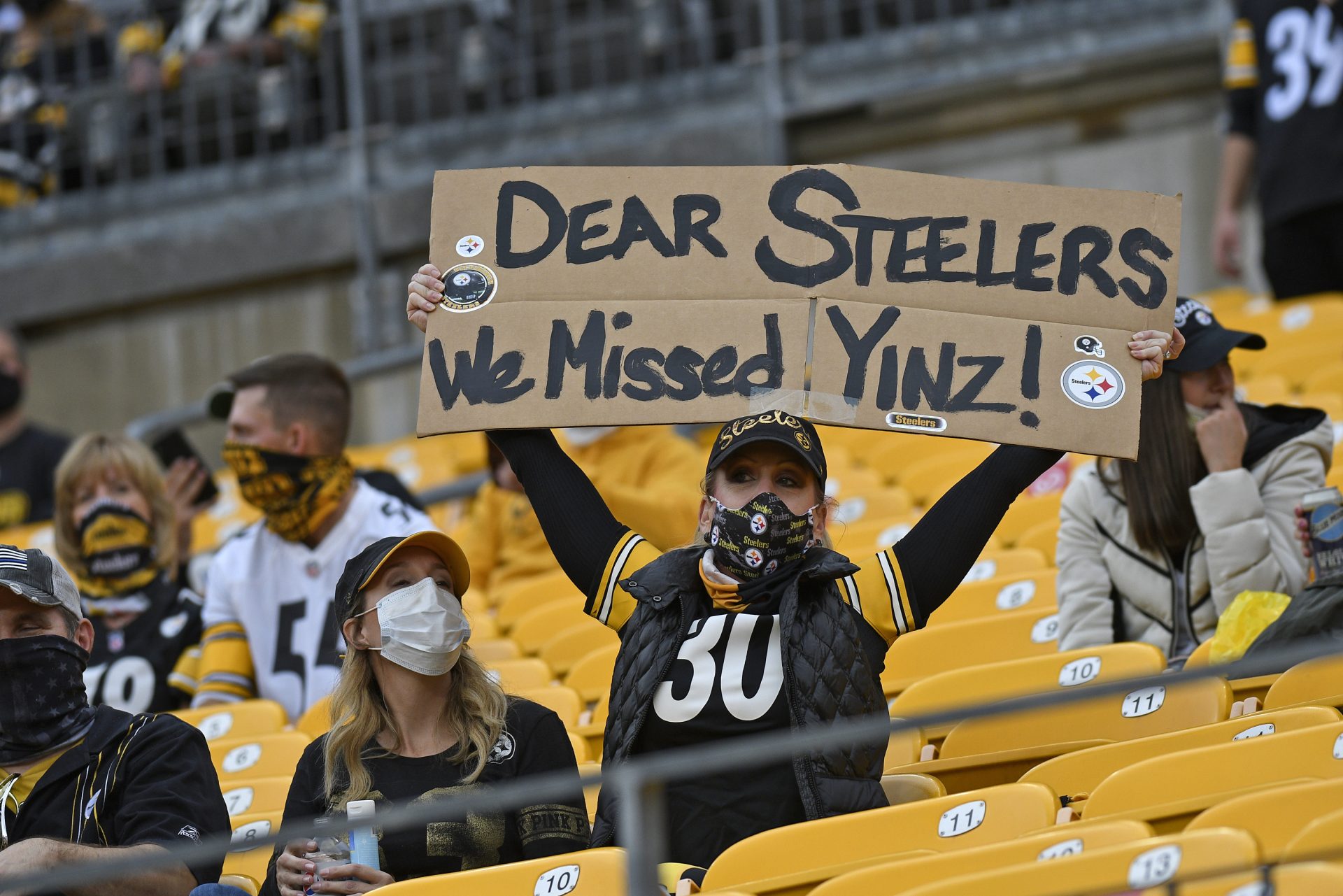A Pittsburgh Steelers fan holds a sign during the first half of an NFL football game against the Philadelphia Eagles in Pittsburgh, Sunday, Oct. 11, 2020.