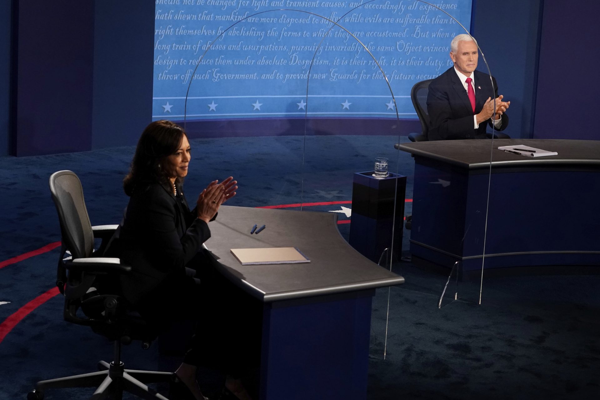 Democratic vice presidential candidate Sen. Kamala Harris, D-Calif., and Vice President Mike Pence applaud after the vice presidential debate Wednesday, Oct. 7, 2020, at Kingsbury Hall on the campus of the University of Utah in Salt Lake City.