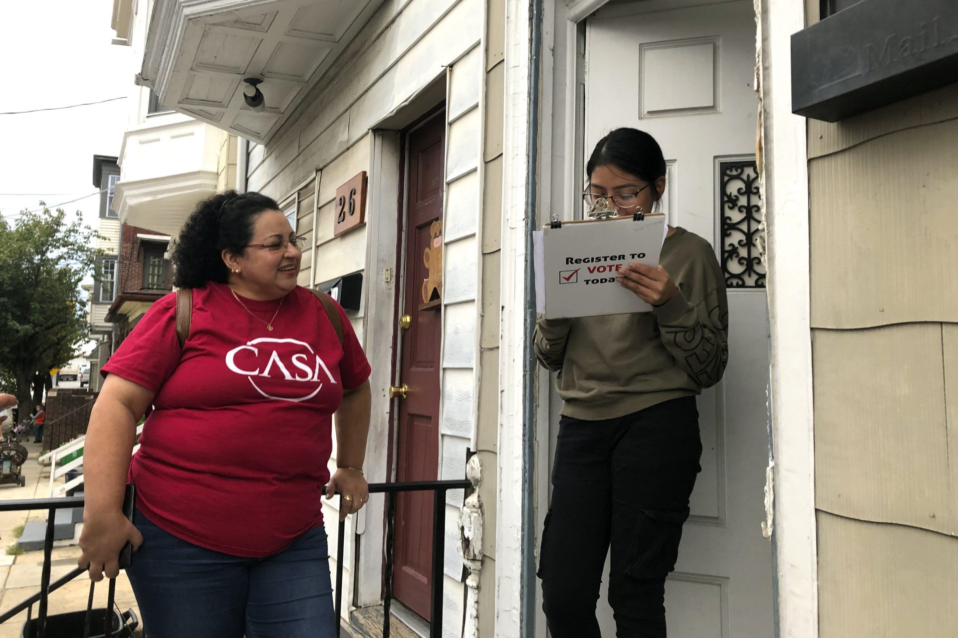 Mirna Orellana, left, a community organizer from the non-profit group We Are Casa, helps Karyme Navarro, right, fill out a voter registration form in York, Pa., on Sept. 30, 2019. Democrats are counting on Hispanics so enraged by President Donald Trump’s anti-immigrant rhetoric that they’ll turn out in force to deny him a second term, but Trump’s reelection campaign has launched its own Hispanic outreach efforts in non-traditional places like Pennsylvania, arguing that even slim gains could decide the 2020 race.