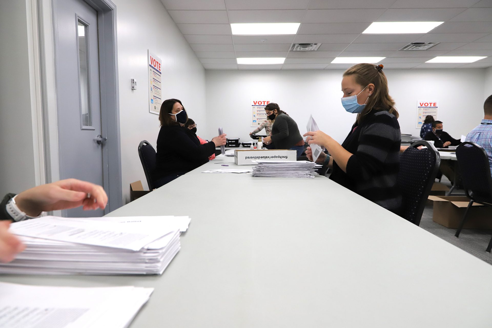 Workers process mail-in ballots at the Cumberland County Bureau of Elections on Nov. 4, 2020.