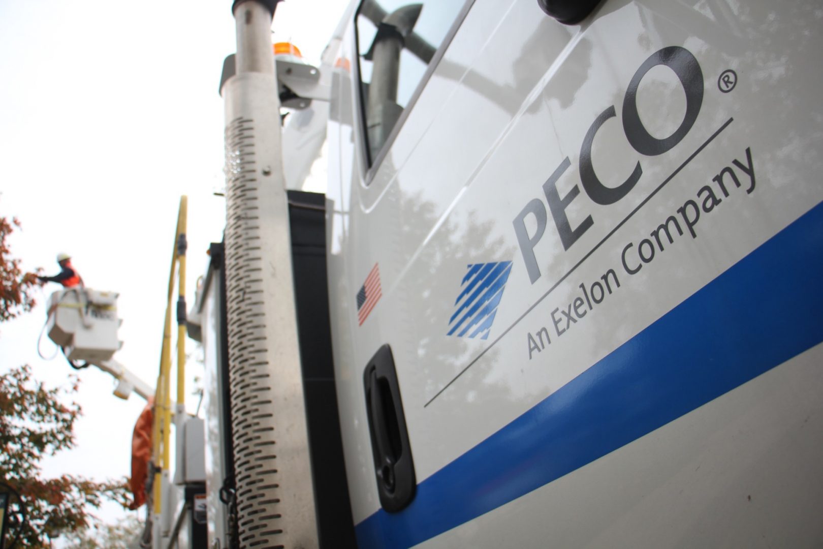 PECO truck in the foreground, PECO worker in the background.