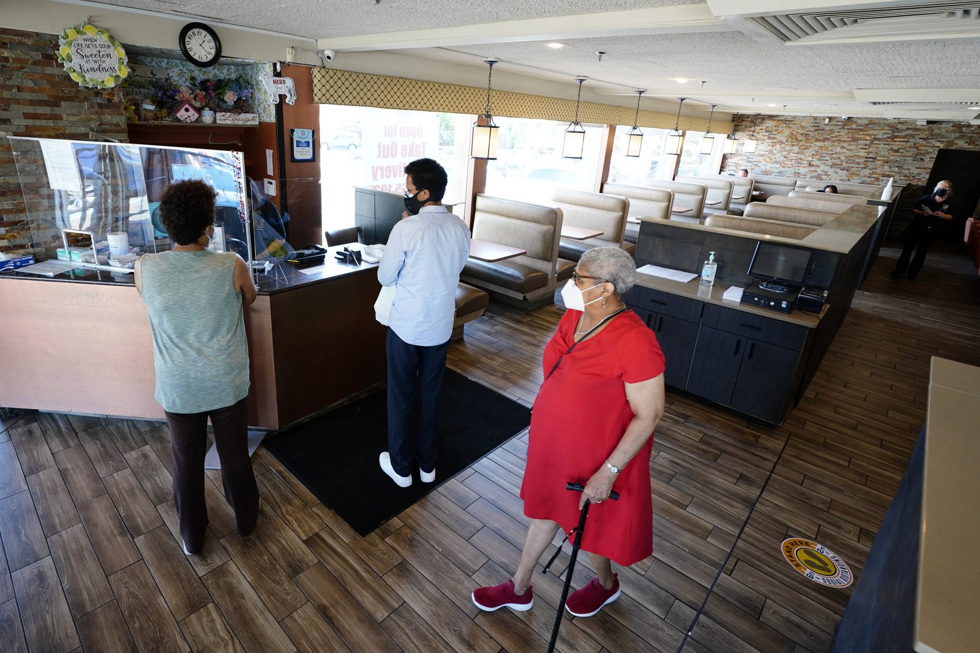 FILE PHOTO: Patrons wait to check out after eating indoors at the Penrose Diner during the coronavirus pandemic, Tuesday, Sept. 8, 2020, in Philadelphia.