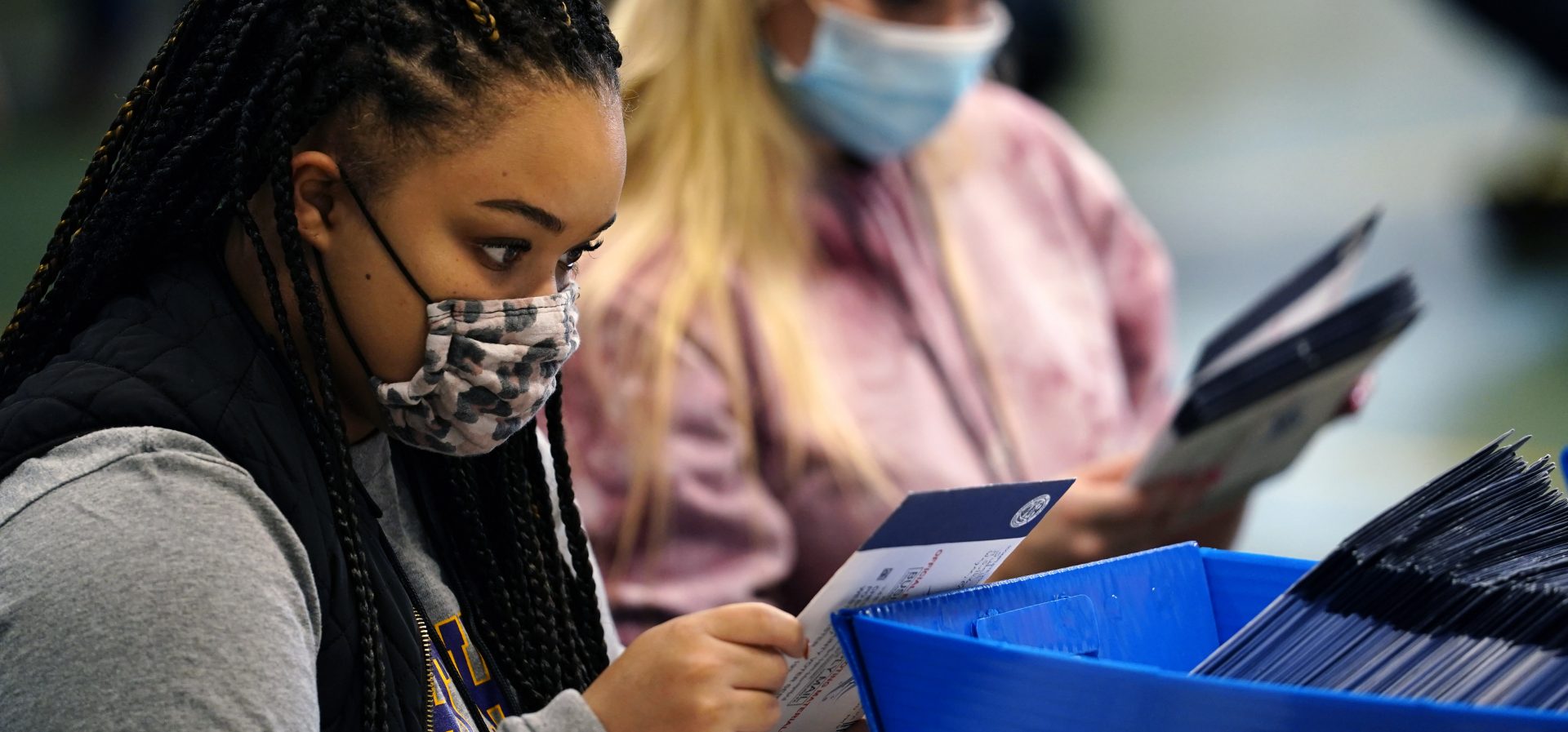 Chester County, Pa., election workers check mail-in and absentee ballots for the 2020 General Election in the United States at West Chester University, Tuesday, Nov. 3, 2020, in West Chester, Pa.