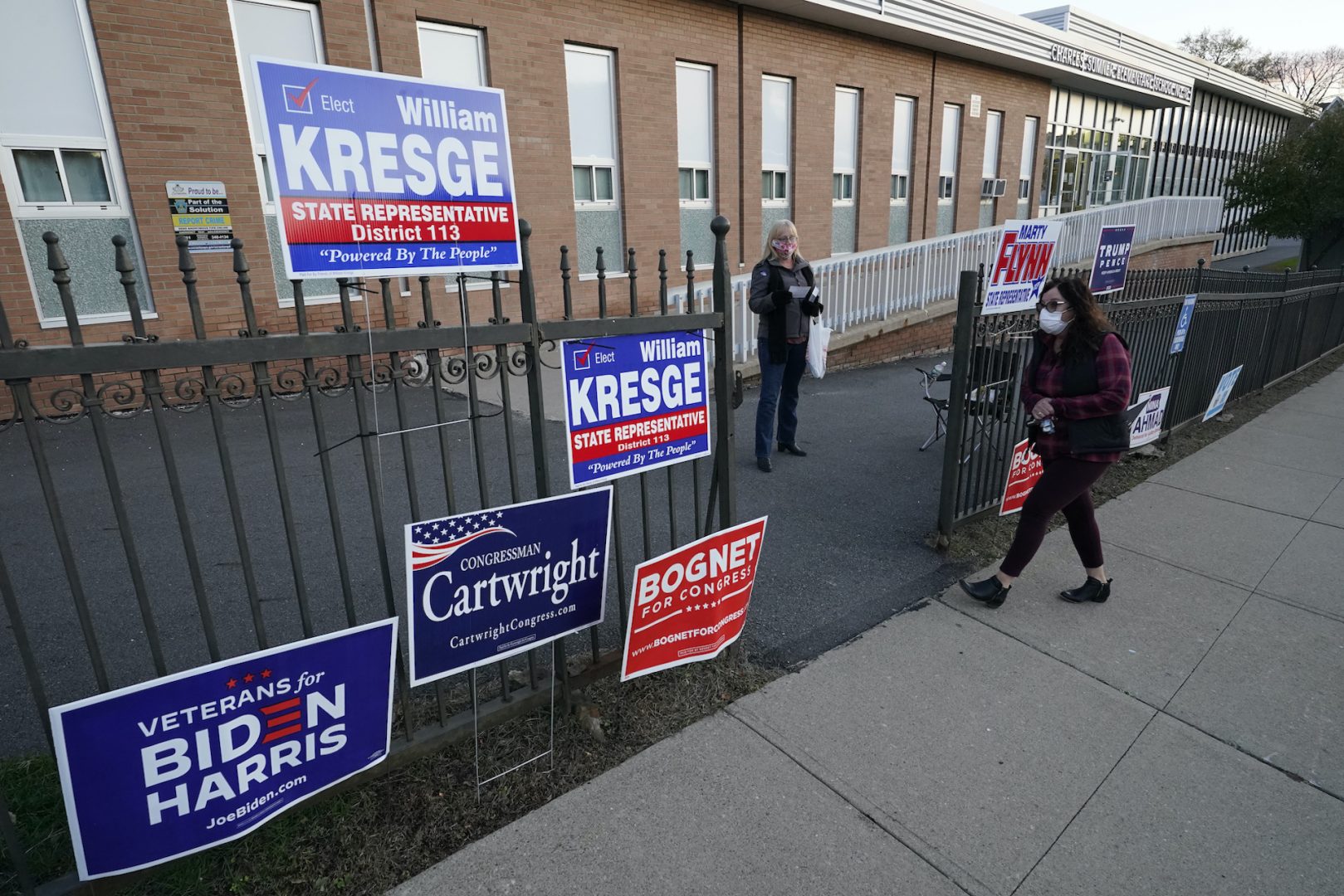 A voter arrives to cast her ballot at the Charles Sumner Elementary School on Election Day, Tuesday, Nov. 3, 2020, in Scranton, Pa. 