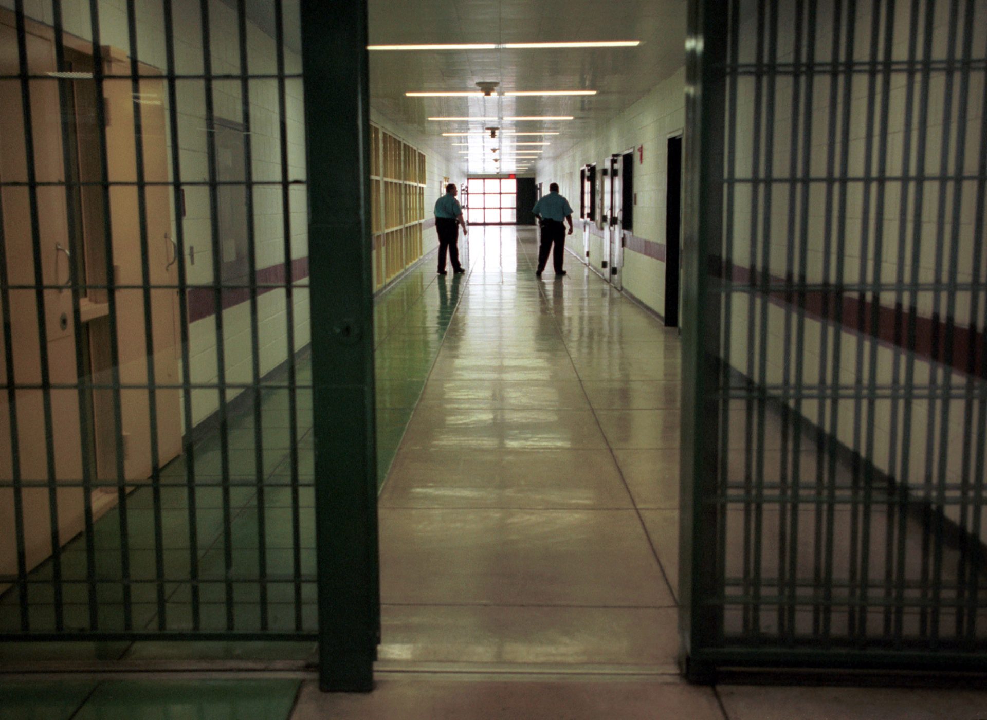 FILE PHOTO: Officers at the Cumberland County Prison walk the halls, Thursday, April 3, 2003, in Carlisle, Pa.