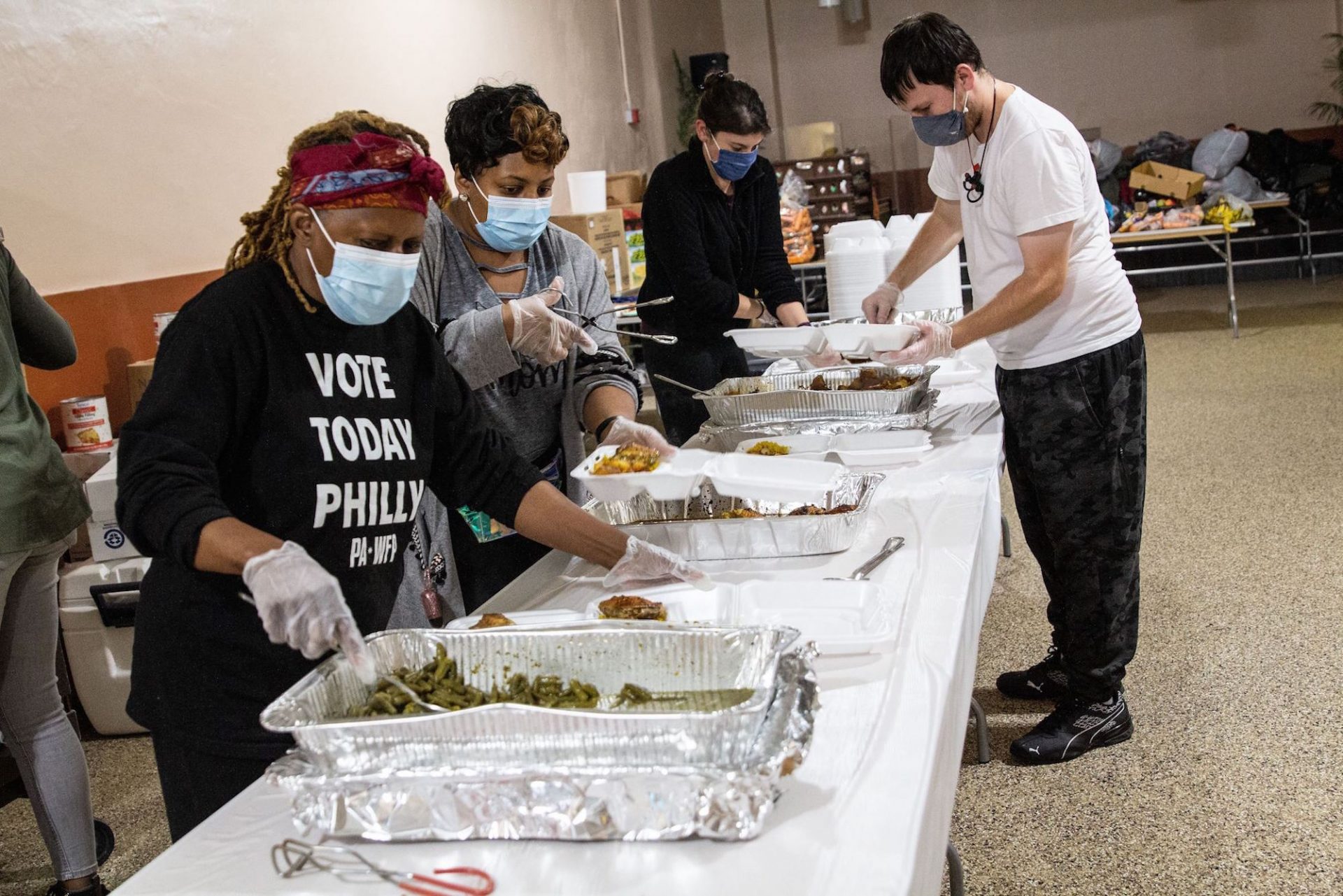 Volunteers at the Chosen 300 Ministries prepare meals for the needy on Spring Garden Street.