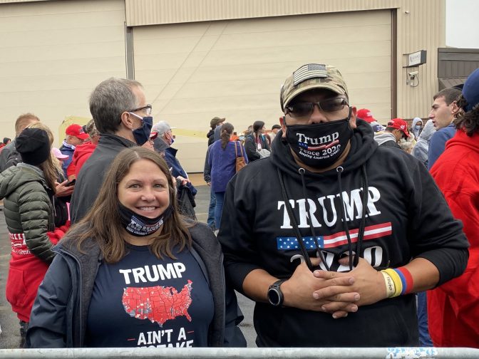 John Rosales and Melissa Gerber wait at the back of the crowd for Trump to speak in Lititz on Oct. 26. Alanna Elder/WITF.