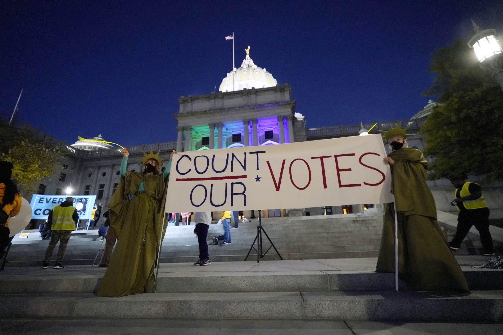 People demonstrate outside the Pennsylvania State Capitol to urge that all votes be counted, Wednesday, Nov. 4, 2020, in Harrisburg, Pa., following Tuesday's election. 