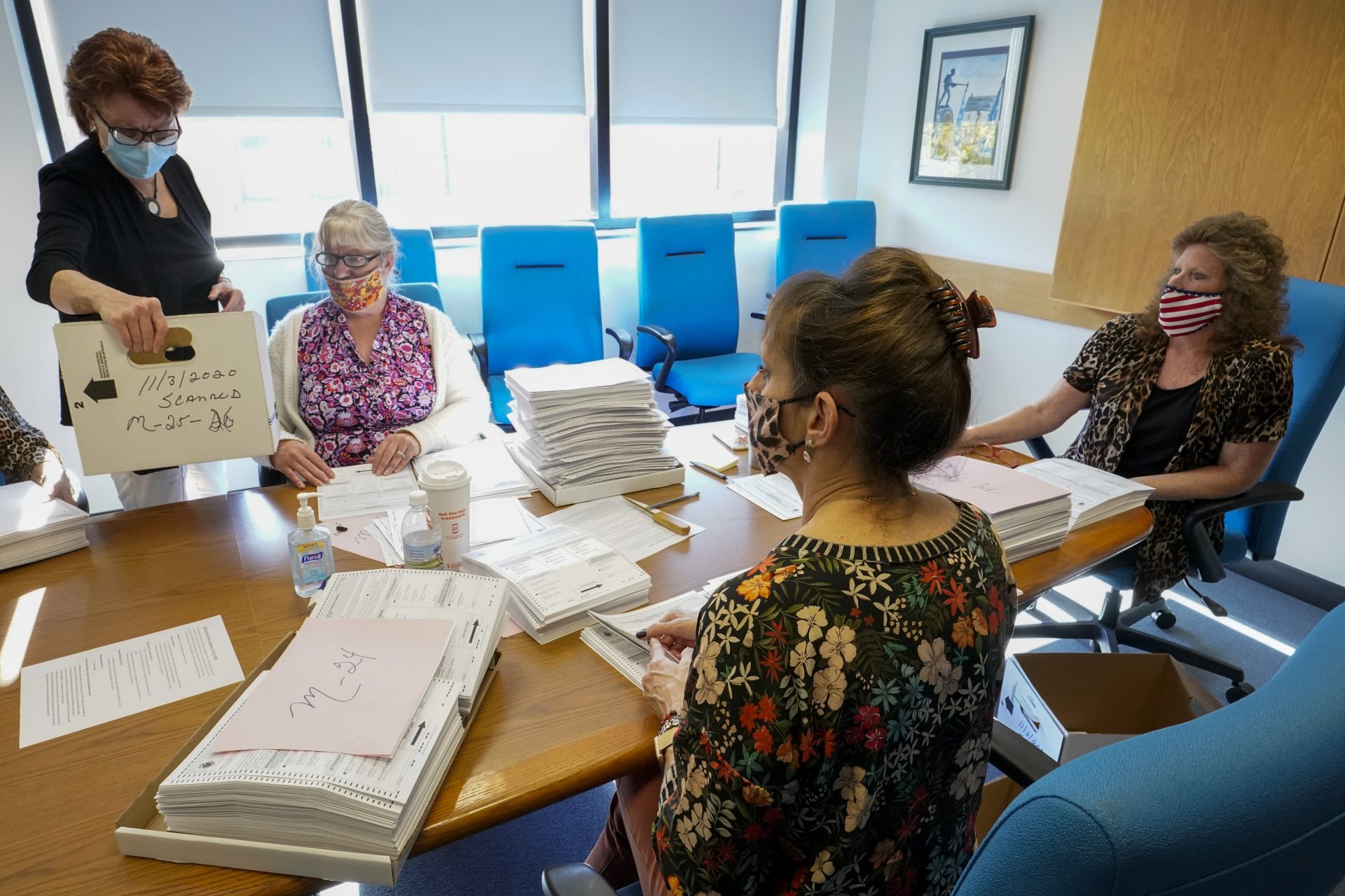 Monroe County municipal workers count ballots as vote counting in the general election continues, Thursday, Nov. 5, 2020, in Stroudsburg, Pa.