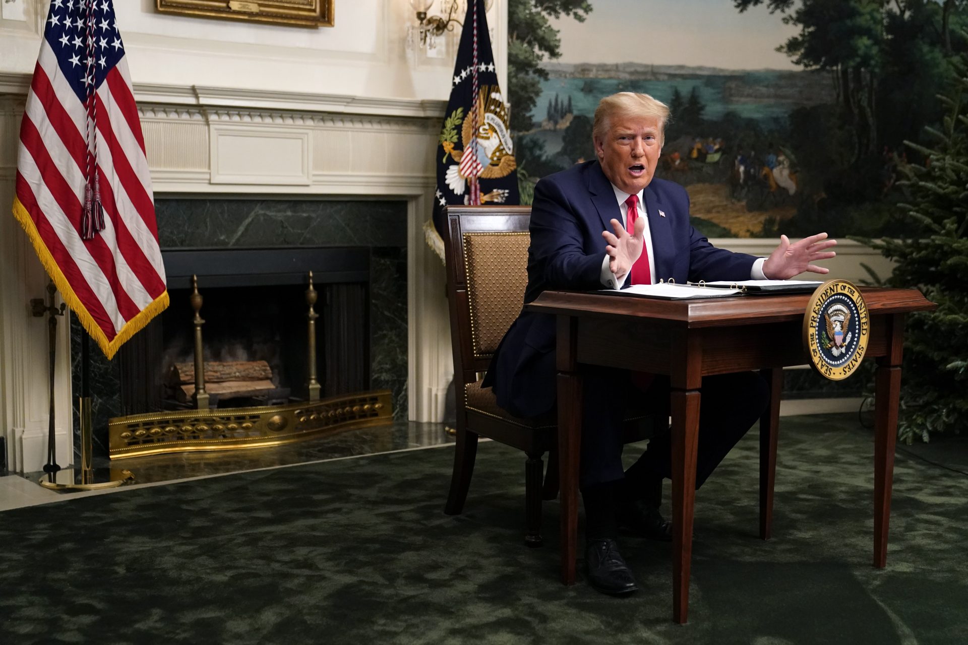 President Donald Trump speaks with reporters after participating in a video teleconference call with members of the military on Thanksgiving, Thursday, Nov. 26, 2020, at the White House in Washington.