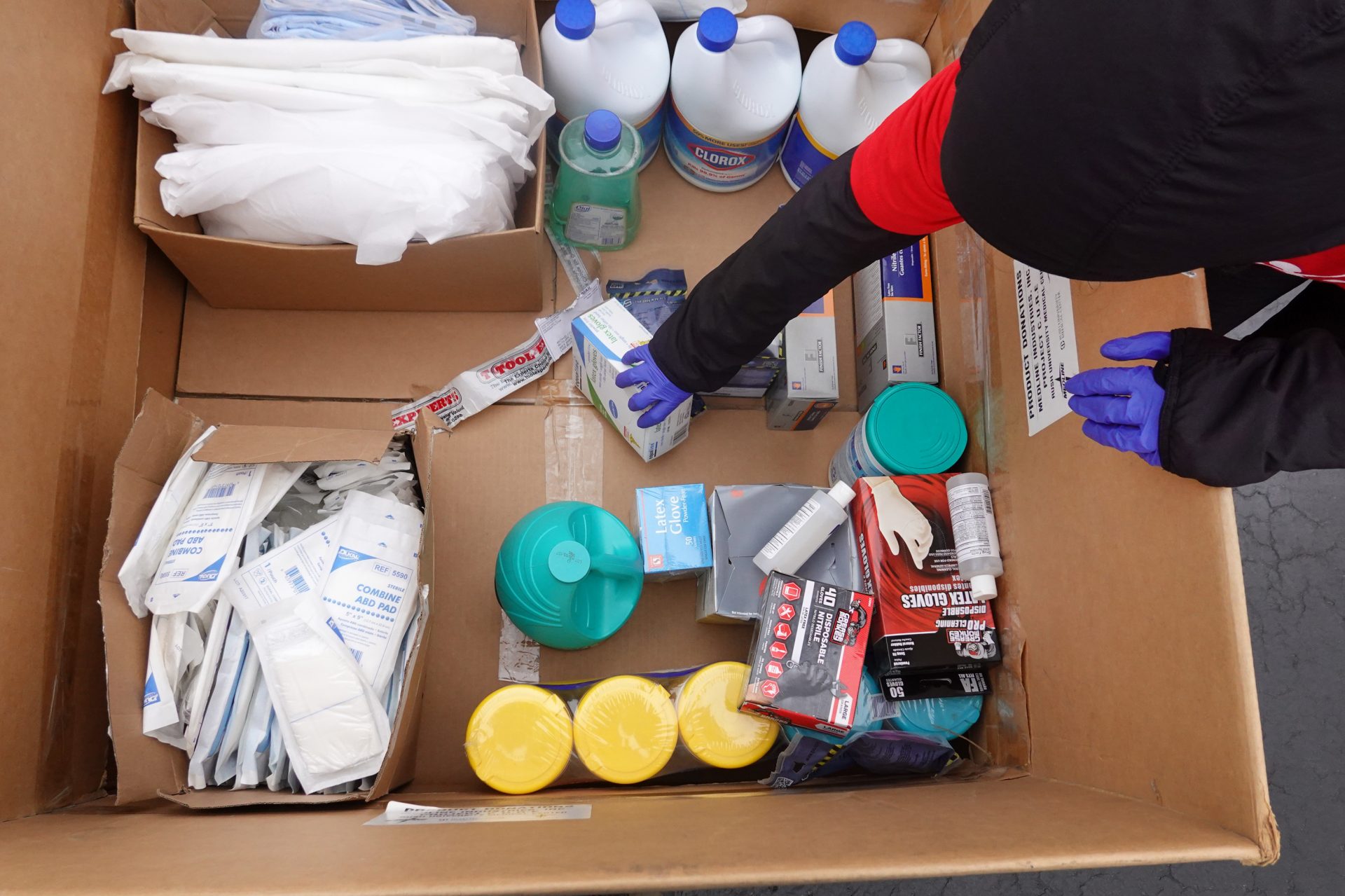 Staff and volunteers with Project CURE held a drive outside the United Center in Chicago to collect donations of PPE from the community which were then used to supply hospitals and clinics experiencing shortages on March 29, 2020.