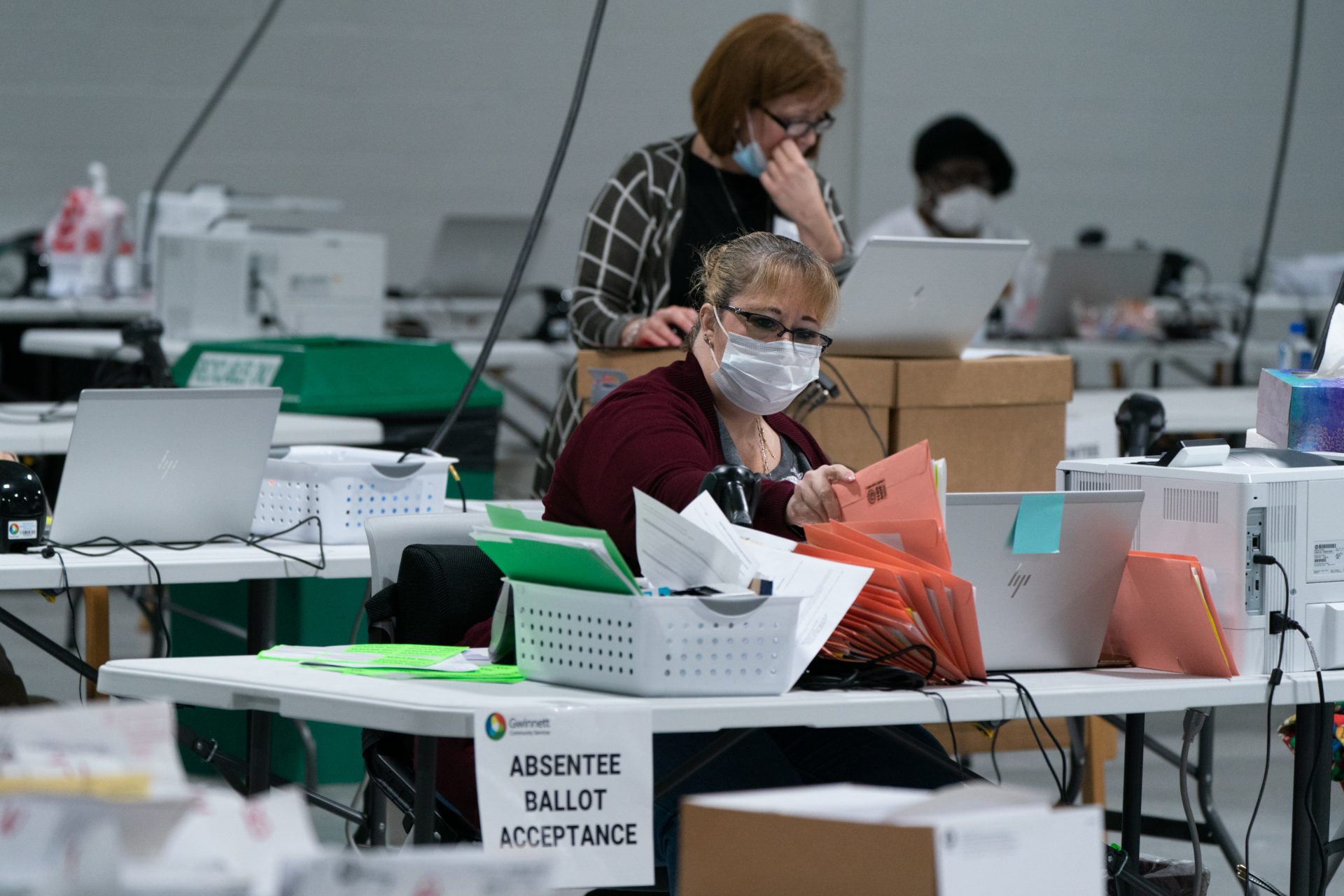 Election personnel sort ballots in preparation for an audit at the Gwinnett County Board of Voter Registrations and Elections offices on November 7, 2020 in Lawrenceville, Ga. President Trump's attempt at legal action to contest the results of the election have so far been mostly unsuccessful.