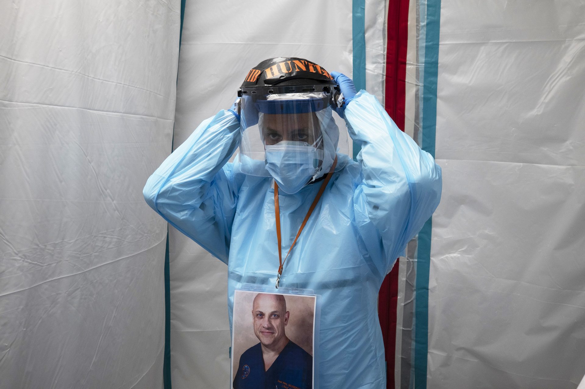 Dr. Joseph Varon puts on his face shield before entering the COVID-19 intensive care unit at United Memorial Medical Center on Monday in Houston. Texas has recorded more than 1.1 million cases of the virus, with more than 20,000 deaths.