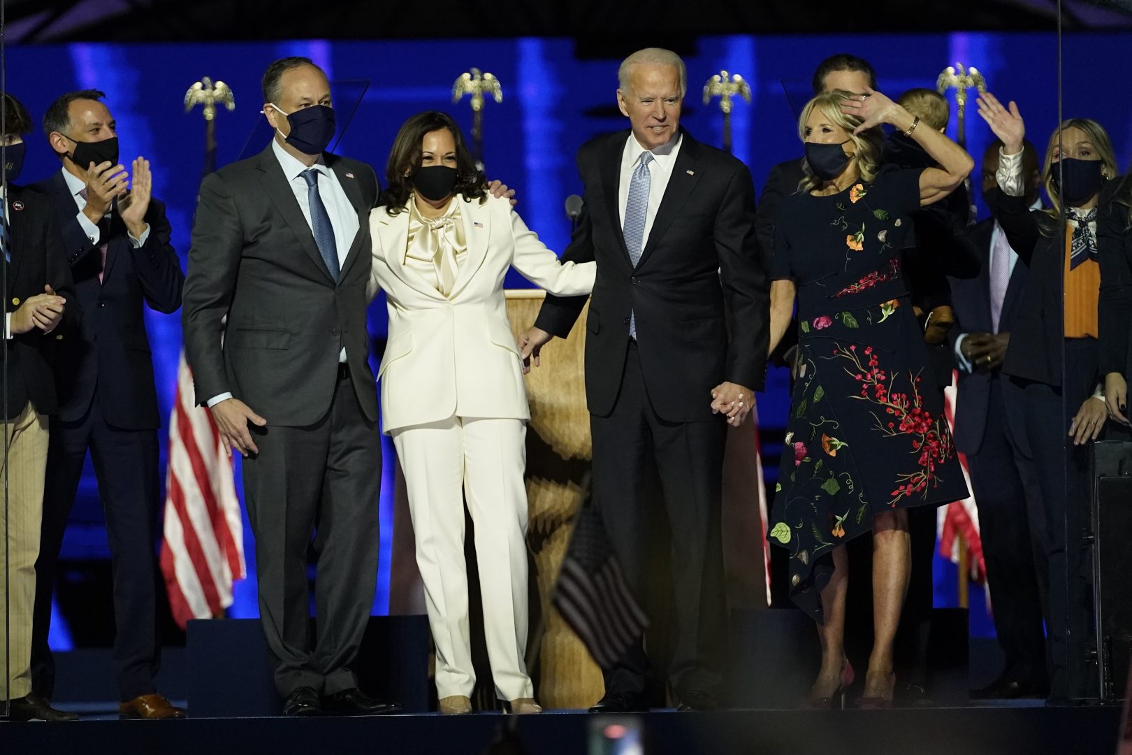 From left, Doug Emhoff, husband of Vice President-elect Kamala Harris, Harris, President-elect Joe Biden and his wife Jill Biden on stage together, Saturday, Nov. 7, 2020, in Wilmington, Del.