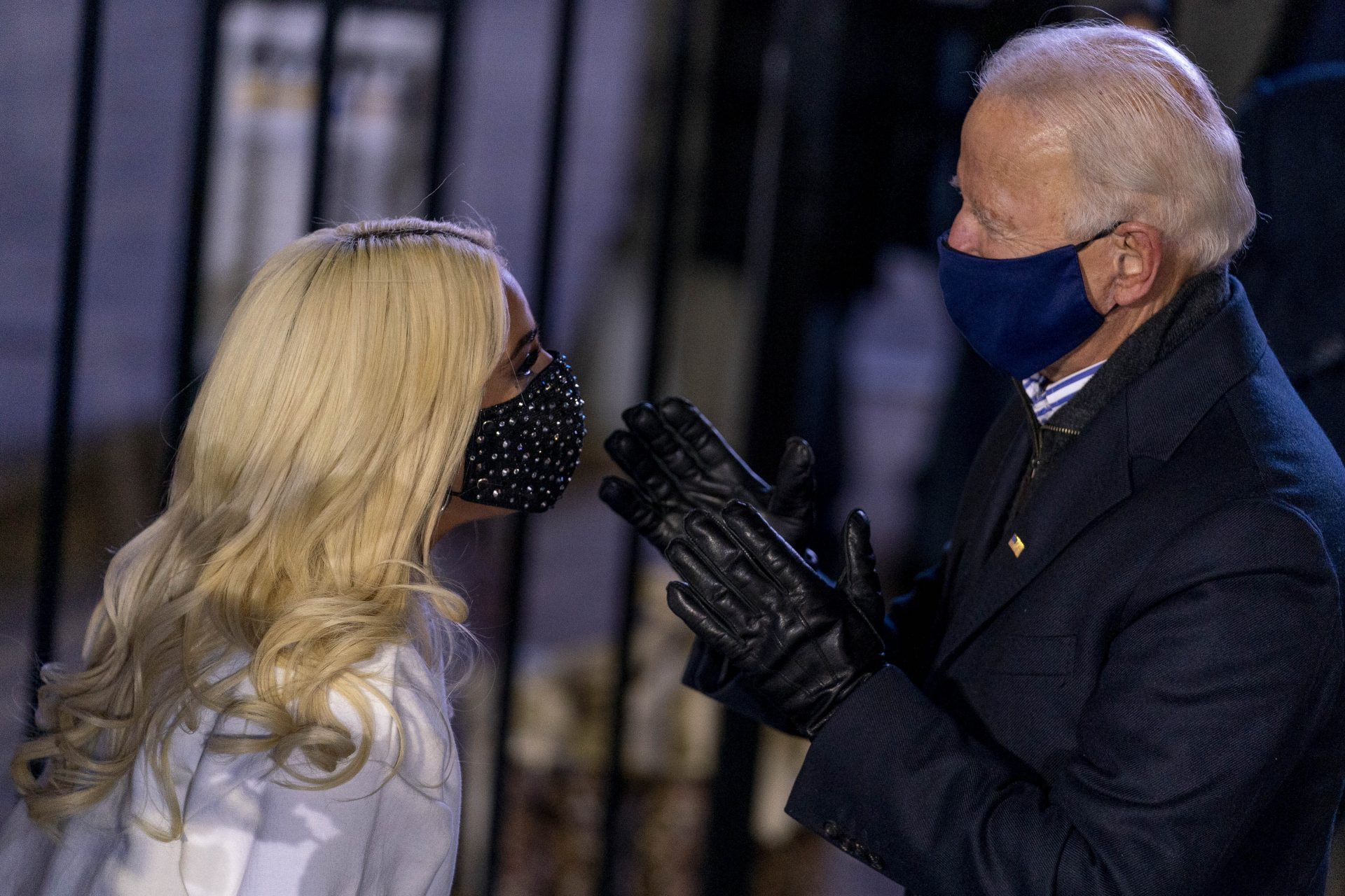 Democratic presidential candidate former Vice President Joe Biden talks with Lady Gaga, left, following a drive-In rally at Heinz Field in Pittsburgh, Monday, Nov. 2, 2020