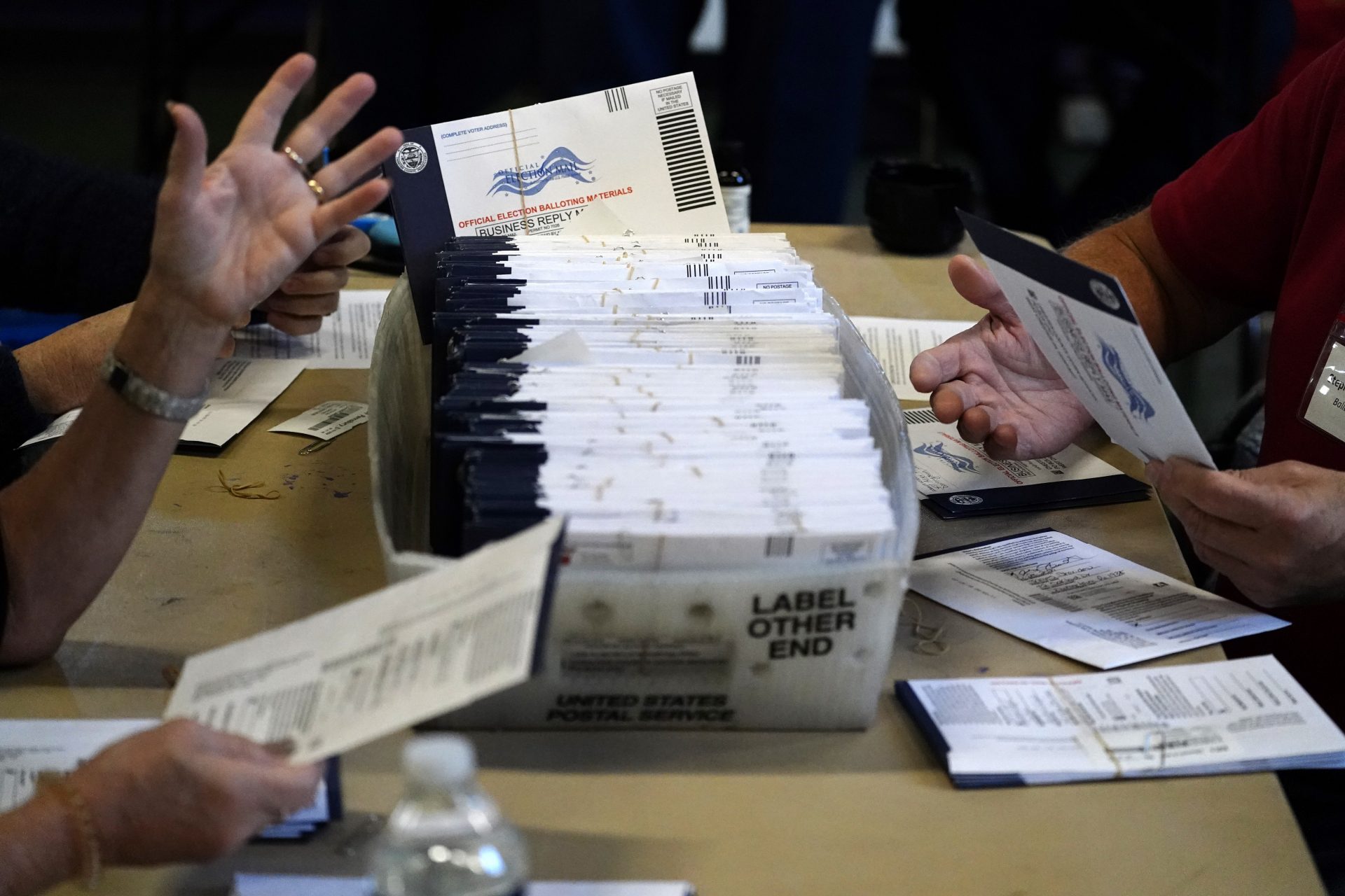 Chester County election workers process mail-in and absentee ballots for the 2020 general election in the United States at West Chester University, Wednesday, Nov. 4, 2020, in West Chester, Pa.