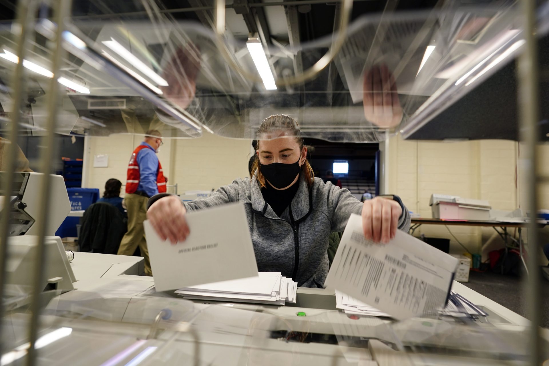 Chester County, Pa., election worker Kristina Sladek opens mail-in and absentee ballots for the 2020 General Election in the United States at West Chester University, Tuesday, Nov. 3, 2020, in West Chester, Pa.