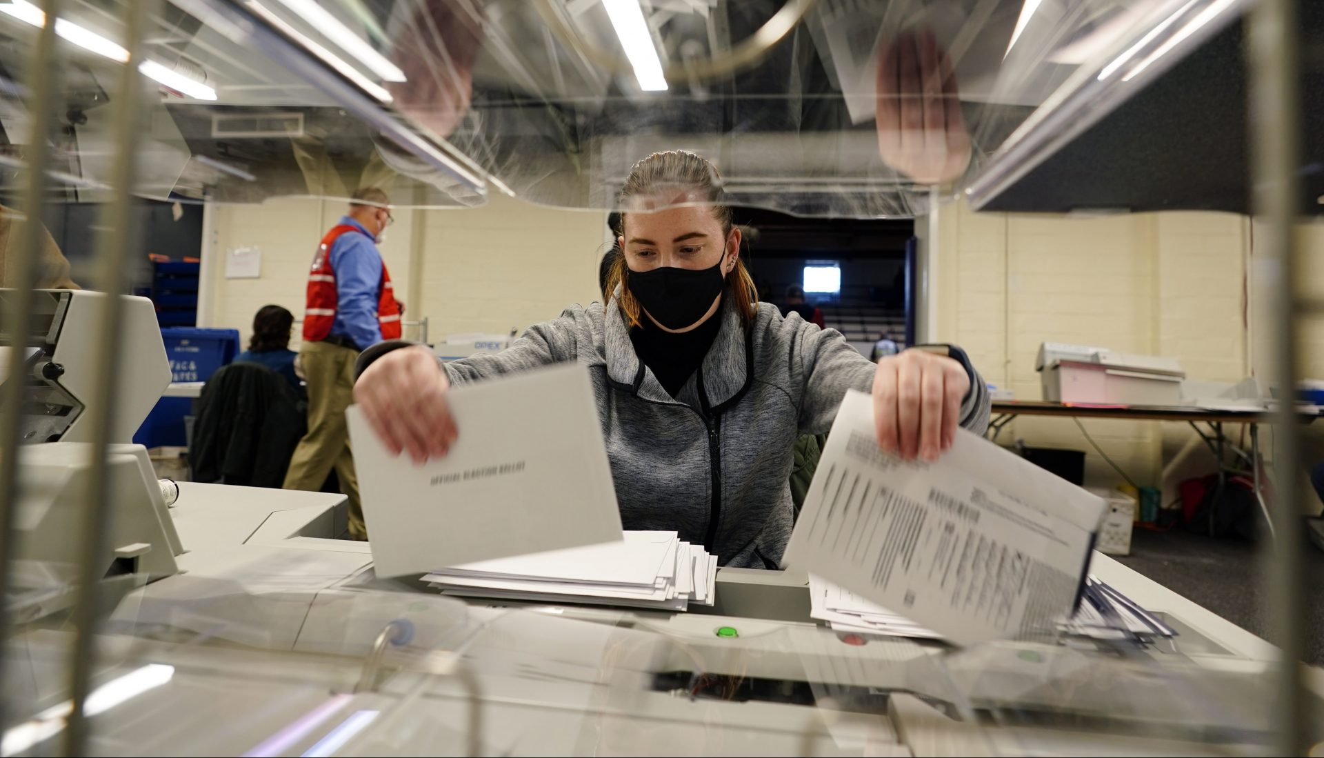 Chester County, Pa., election worker Kristina Sladek opens mail-in and absentee ballots for the 2020 General Election in the United States at West Chester University, Tuesday, Nov. 3, 2020, in West Chester, Pa.