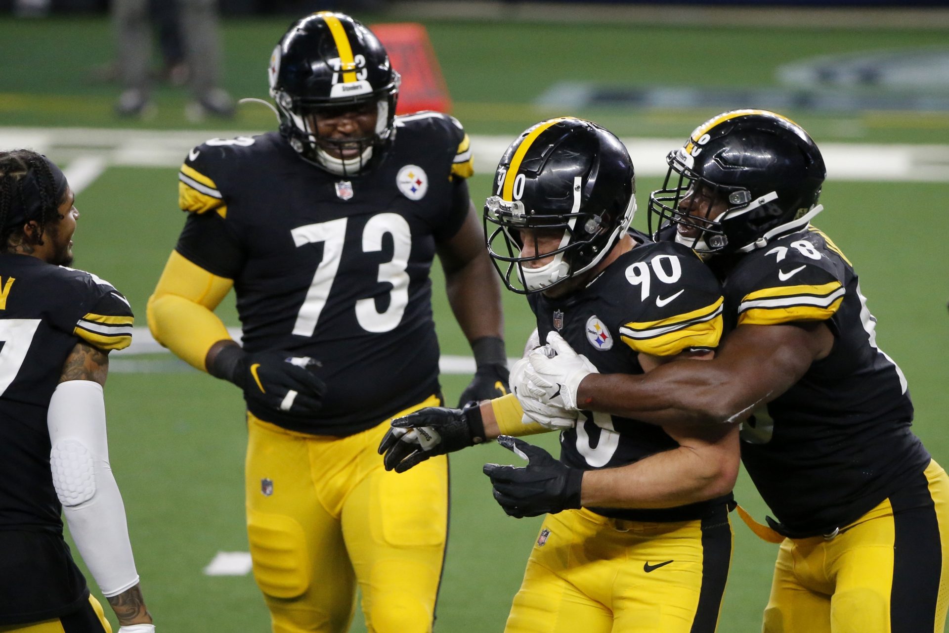 Pittsburgh Steelers' Carlos Davis (73), T.J. Watt (90) and Vince Williams, right, celebrate after Watt helped on a sack of Dallas Cowboys quarterback Garrett Gilbert (3) in the second half of an NFL football game in Arlington, Texas, Sunday, Nov. 8, 2020.