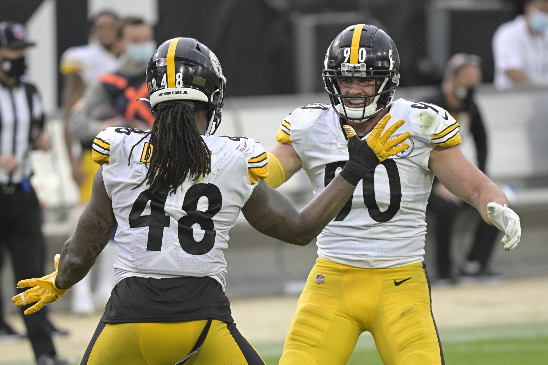 Pittsburgh Steelers linebacker Bud Dupree (48) and linebacker T.J. Watt, right, celebrate a big play against the Jacksonville Jaguars during the second half of an NFL football game, Sunday, Nov. 22, 2020, in Jacksonville, Fla.