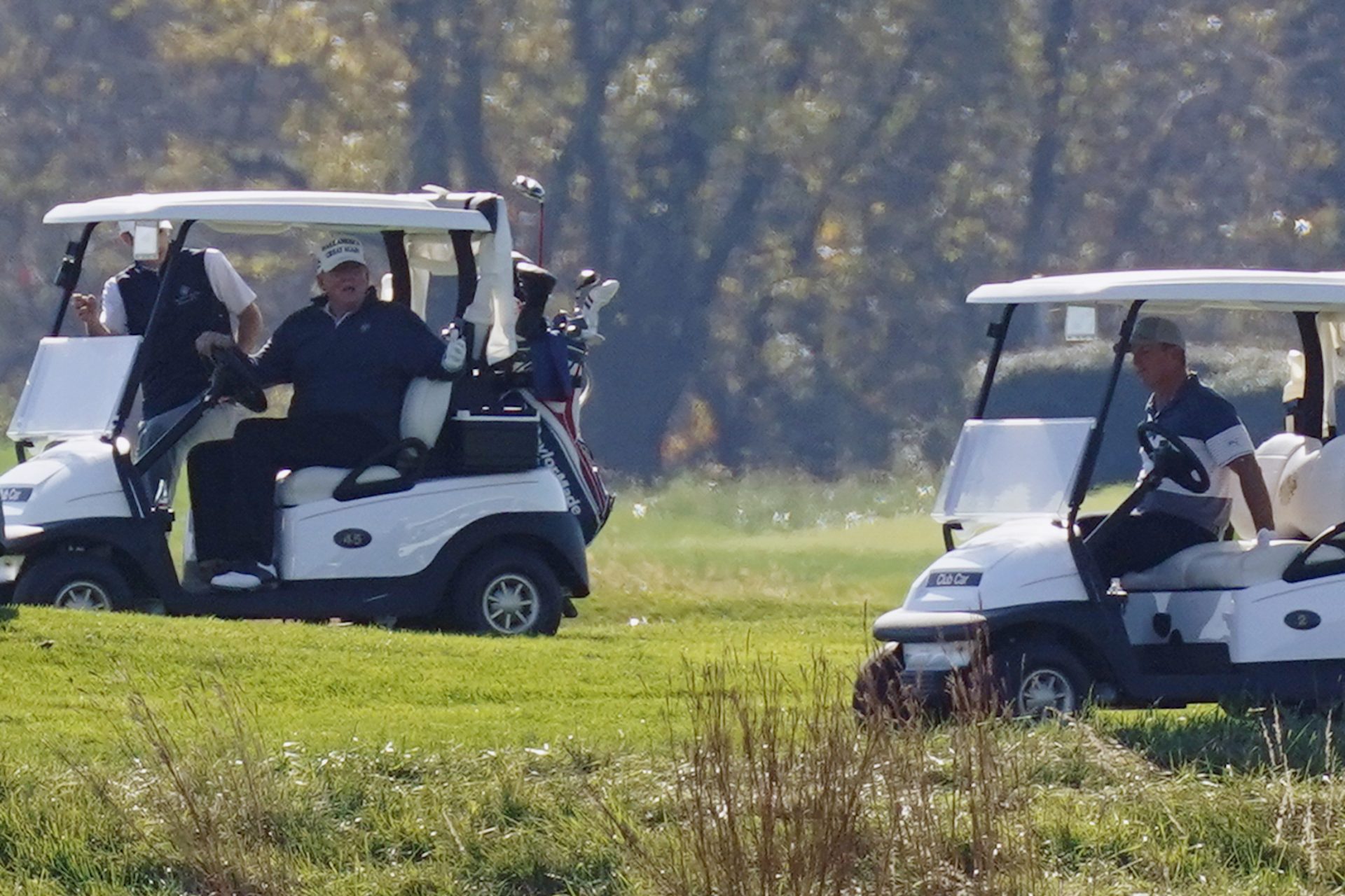 President Donald Trump participates in a round of golf at the Trump National Golf Course on Saturday, Nov. 7, 2020, in Sterling, Va.