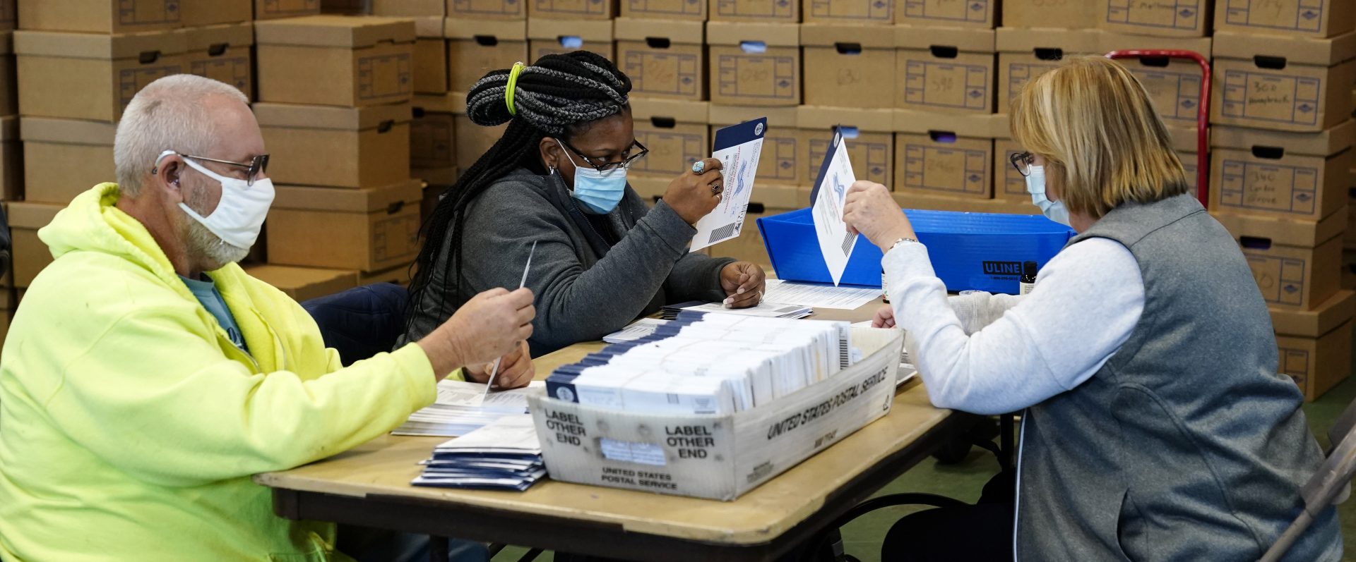 Chester County, Pa., election workers process mail-in and absentee ballots for the 2020 general election in the United States at West Chester University, Wednesday, Nov. 4, 2020, in West Chester., Pa.