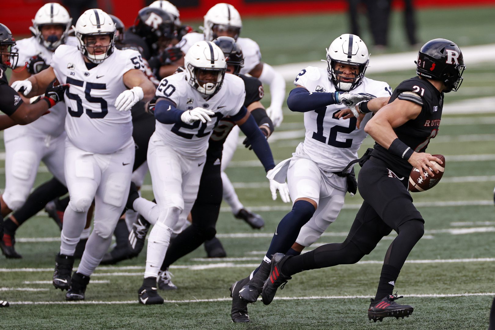 Penn State linebacker Brandon Smith (12) tackles Rutgers quarterback Johnny Langan (21) during the first half of an NCAA college football game Saturday, Dec. 5, 2020, in Piscataway, N.J.