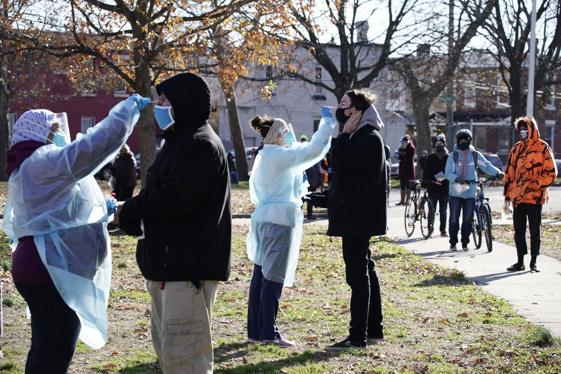 Registered nurses swab patients during testing for COVID-19 organized by Philadelphia FIGHT Community Health Centers at Mifflin Square Park, Thursday, Dec. 10, 2020, in south Philadelphia.