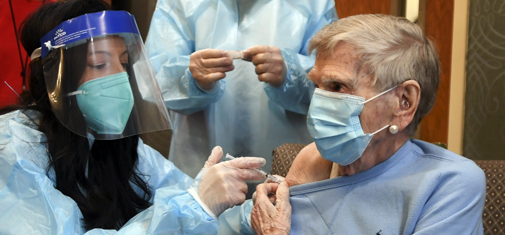 Mary Lou Galushko gives Jeanne Peters, 95, the first COVID-19 vaccination at The Reservoir nursing home on Friday, Dec. 18, 2020, in West Hartford, Conn.