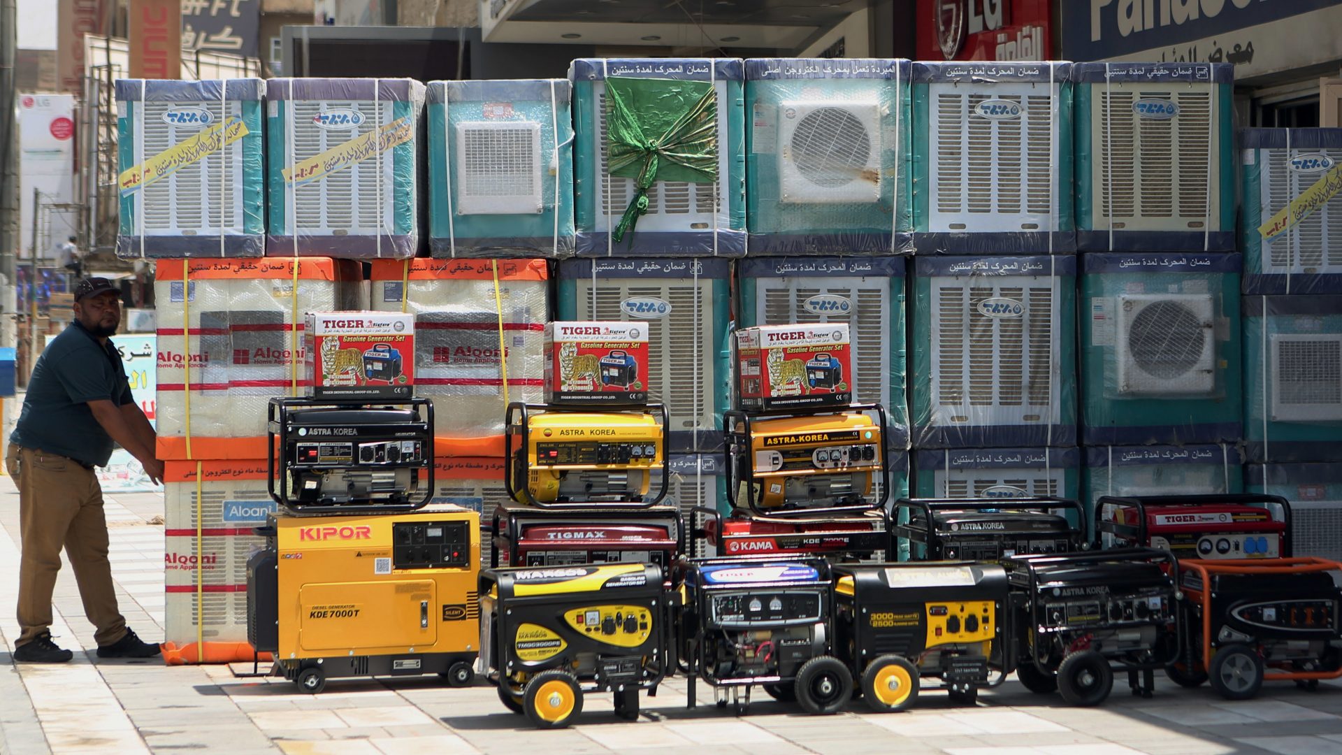 FILE PHOTO: In this Thursday, July 30, 2015 file photo, air conditioners and power generators are displayed on a street in central Baghdad, Iraq. Nations reached a deal Saturday, Oct. 15, 2016 to limit the use of hydrofluorocarbons, or HFCs - greenhouse gases far more powerful than carbon dioxide that are used in air conditioners and refrigerators, in a major effort to fight climate change.