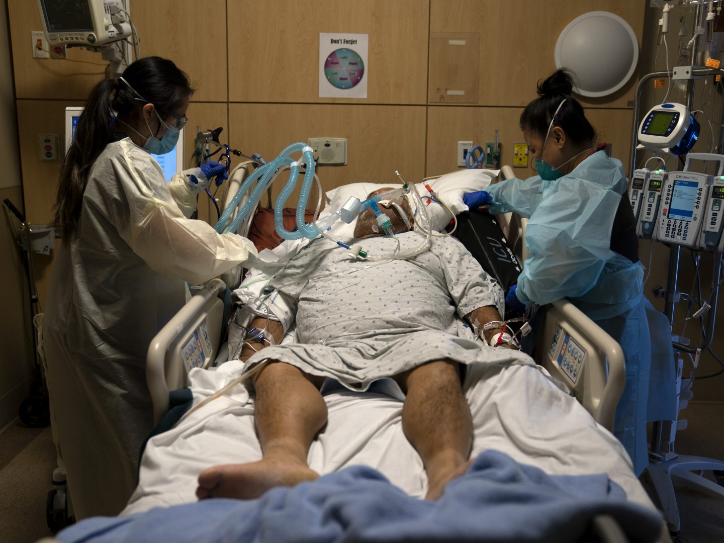 FILE — In this Nov. 19, 2020 file photo Registered nurses Karen Ross, right, and Angela Nguyen assist a COVID-19 patient at Providence Holy Cross Medical Center in the Mission Hills section of Los Angeles. A letter dated Nov. 25, 2020, from the California Department of Health now 