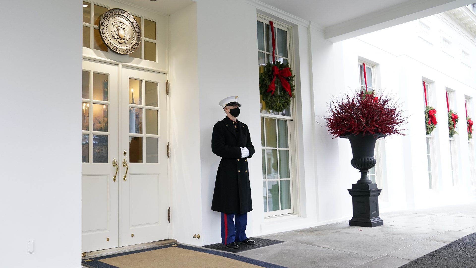 A marine stands outside the West Wing of the White House in Washington, Wednesday, Dec. 16, 2020.