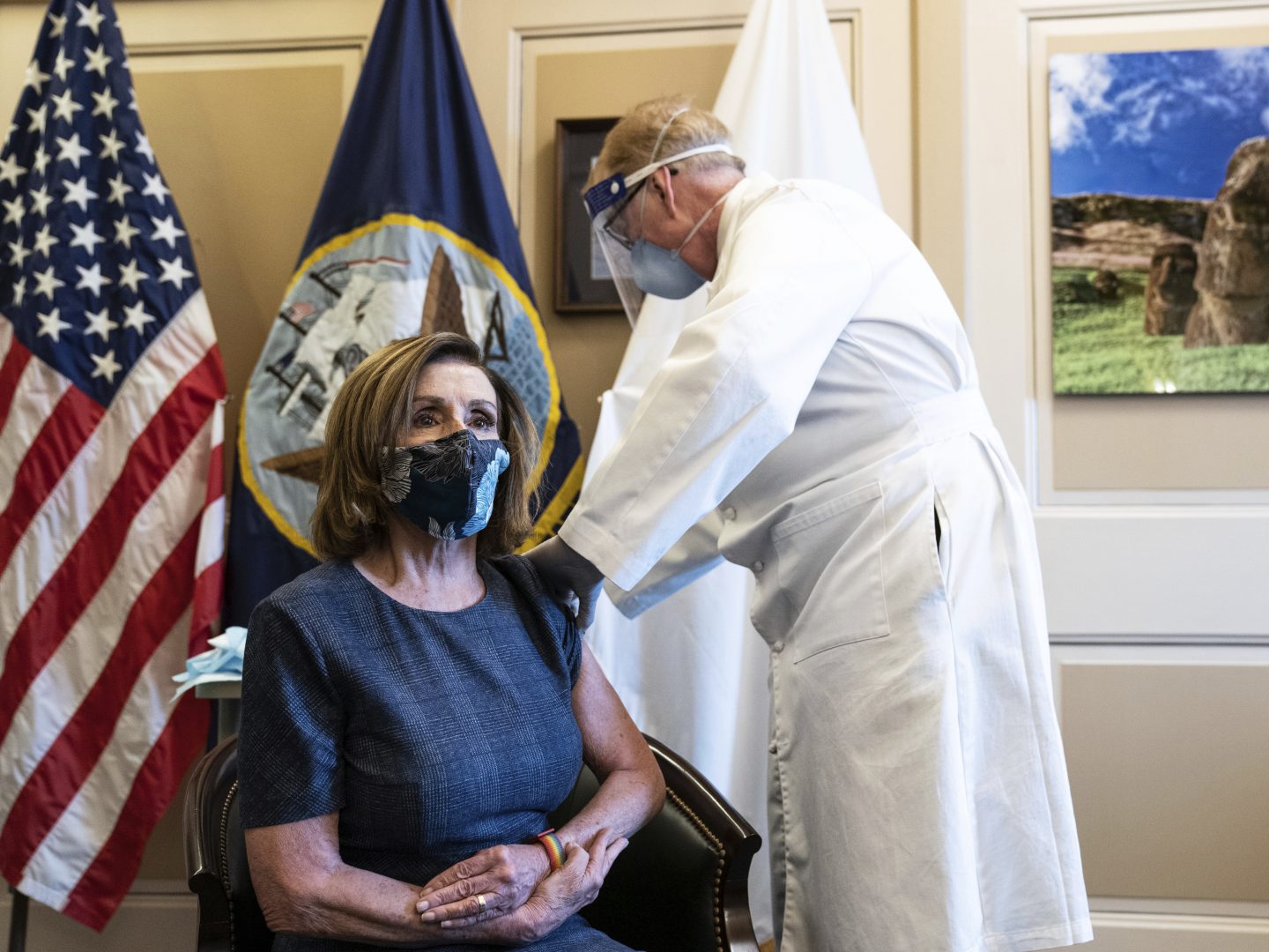 Speaker of the House Nancy Pelosi, D-Calif., receives a Pfizer-BioNTech COVID-19 vaccine shot by Dr. Brian Monahan, attending physician Congress of the United States in Washington, Friday, Dec. 18, 2020. 