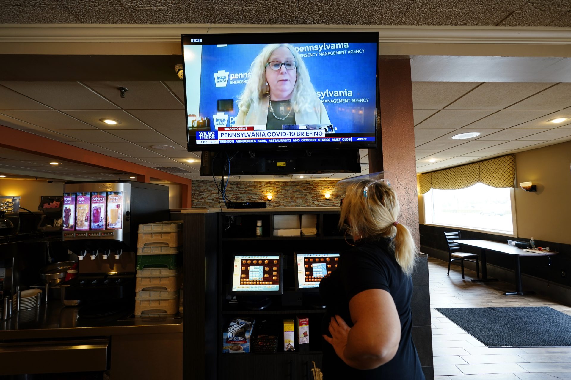 Waitress Lauren Musial watches a television briefing by Pennsylvania Health Secretary, Dr. Rachel Levine, at the Penrose Diner, Tuesday, Nov. 17, 2020, in South Philadelphia.