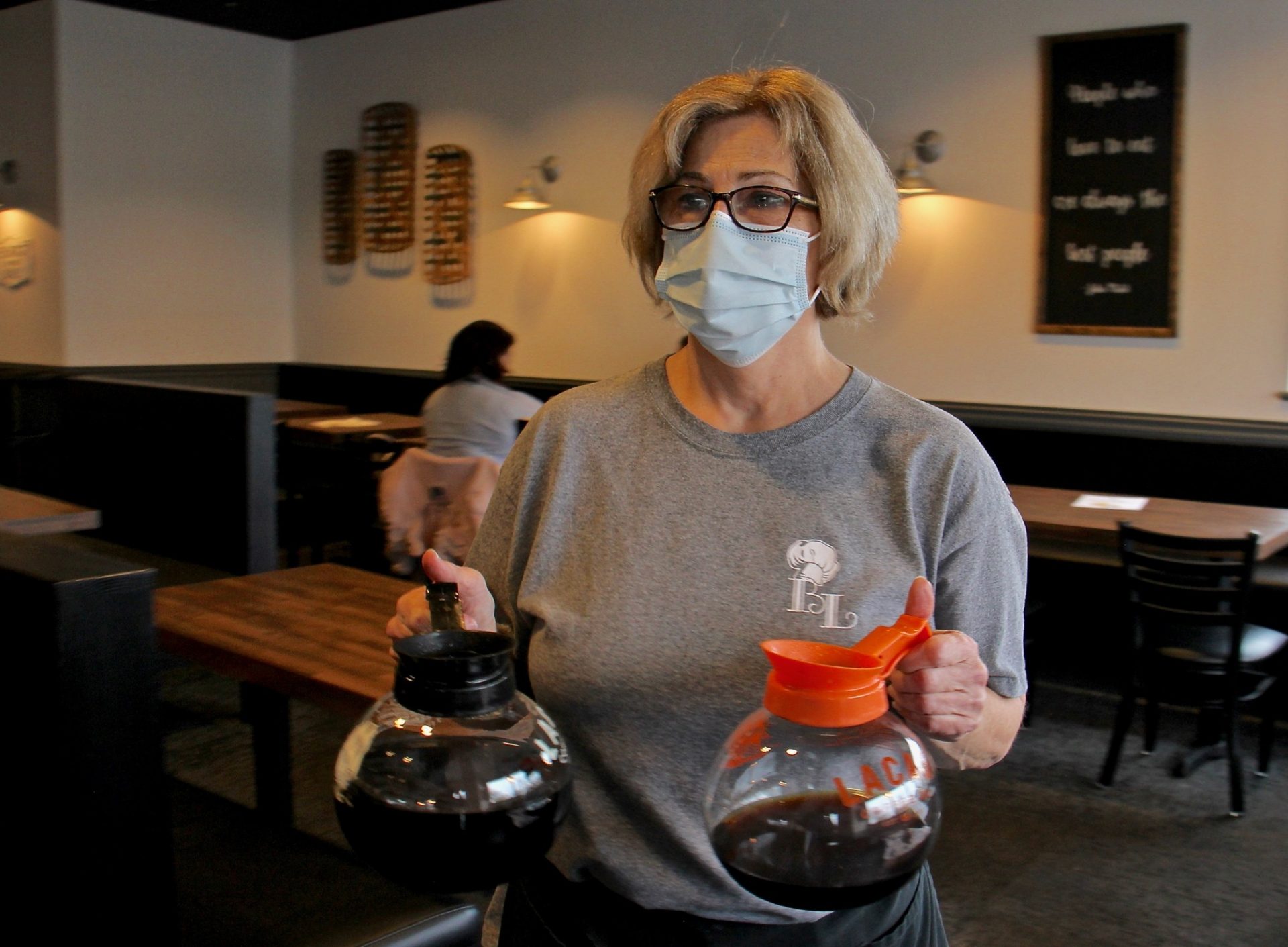 Laura Tierney, manager of Bonnet Lane Family Restaurant in Abington, Pa., serves customers in the dining room.