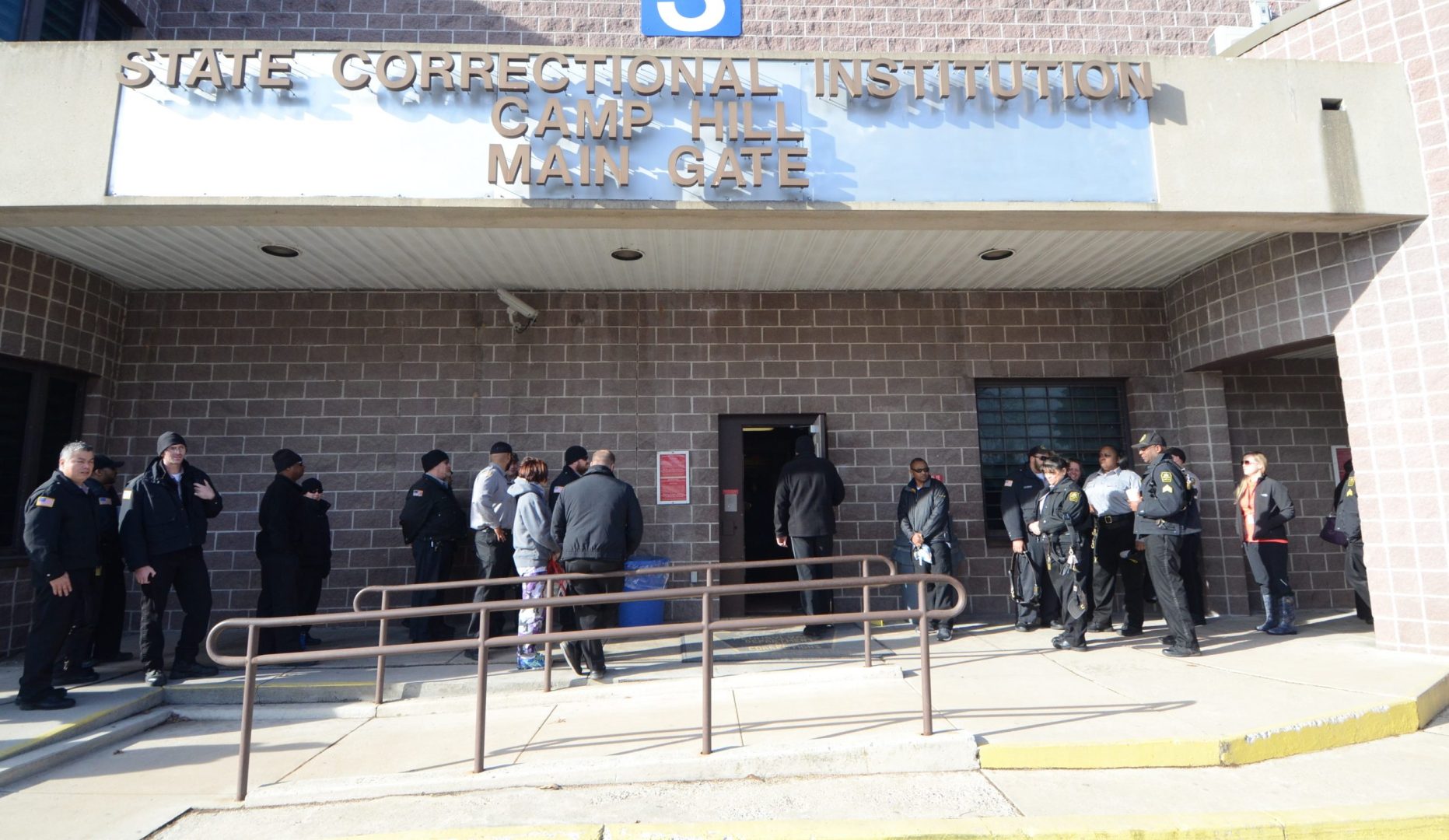 FILE PHOTO: Corrections officers arrive for their shift at the State Correctional Institution at Camp Hill on Jan. 13, 2017, in Camp Hill, Pa.