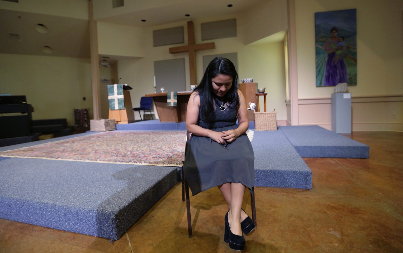 FILE PHOTO: In this Wednesday, Feb. 22, 2017 photo, Hilda Ramirez, an immigrant living illegally in the U.S, sits in the sanctuary at St. Andrew's Presbyterian Church as she waits to talk to a reporter, Wednesday, in Austin, Texas. Ramirez, from Guatemala, and her son have taken refuge at the church.