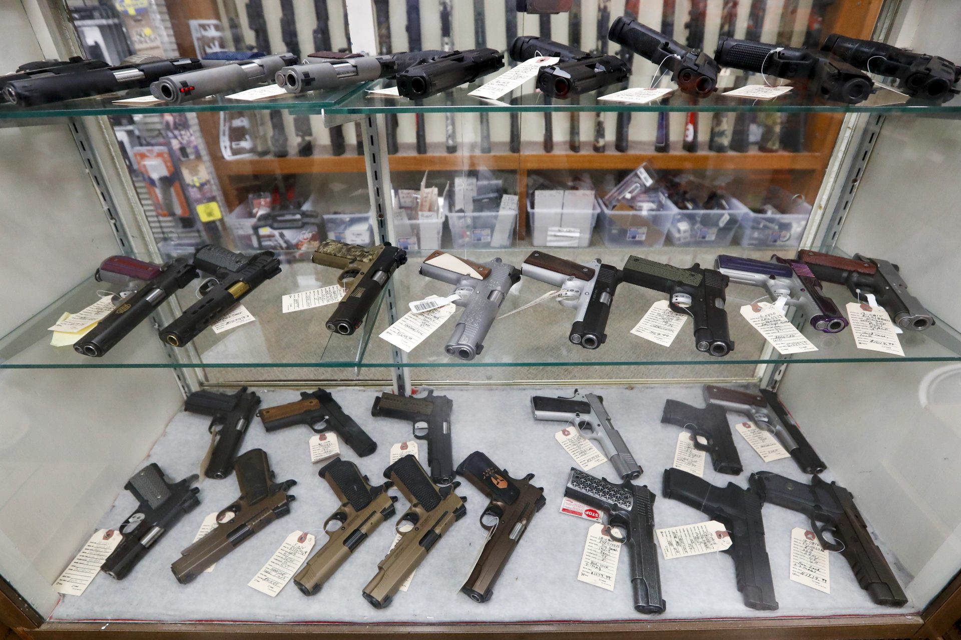 FILE PHOTO: Semi-Automatic handguns are displayed at Duke's Sport Shop, Wednesday, March 25, 2020, in New Castle, Pa.